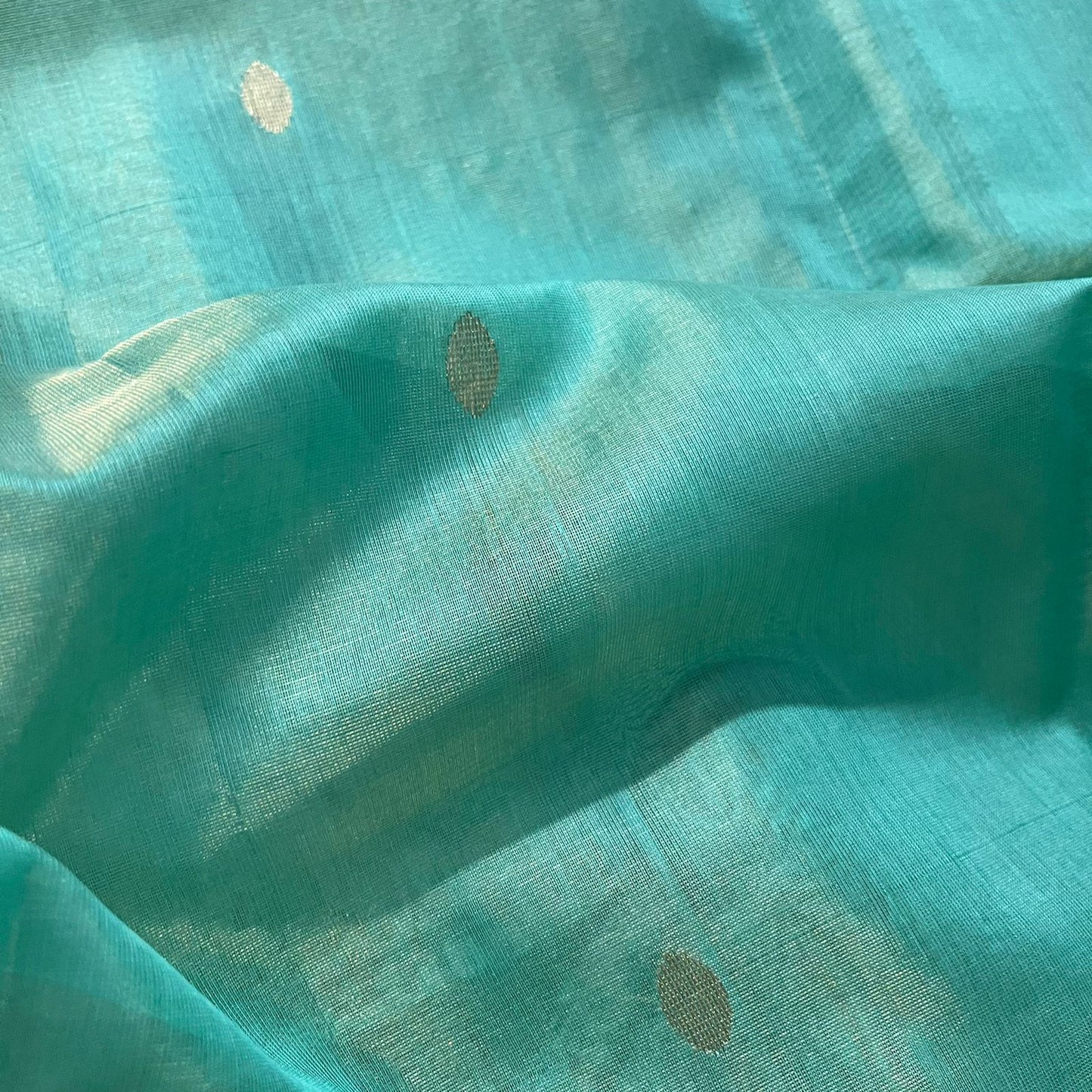 Turquoise maheshwari tissue silk saree with zari bootis all over