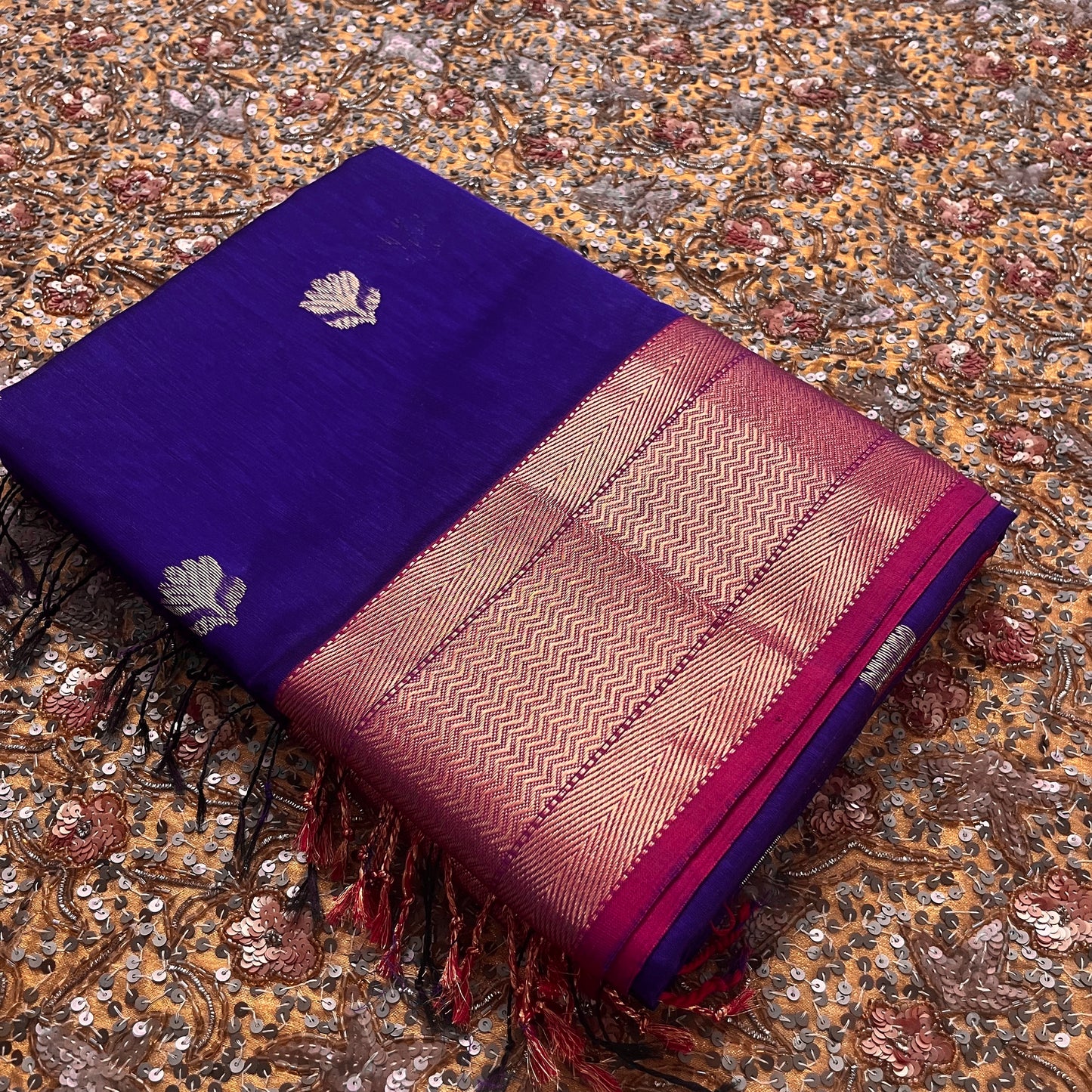 Dark purple and pink maheshwari with flower motifs all over