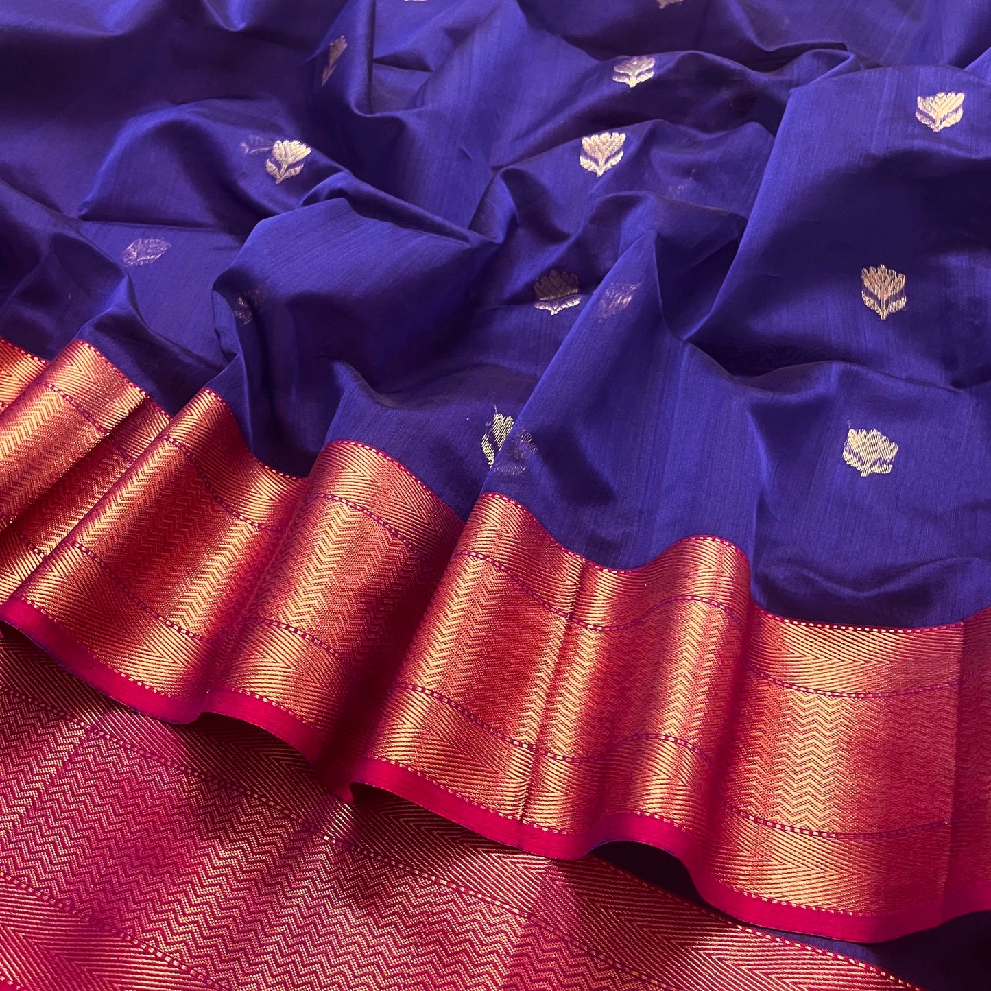 Dark purple and pink maheshwari with flower motifs all over