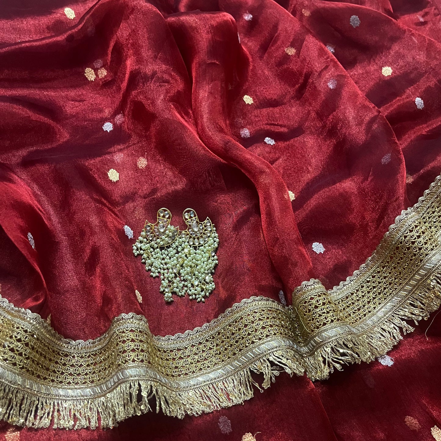 Maroon banarasi tissue silk saree with zari bootis and zari border