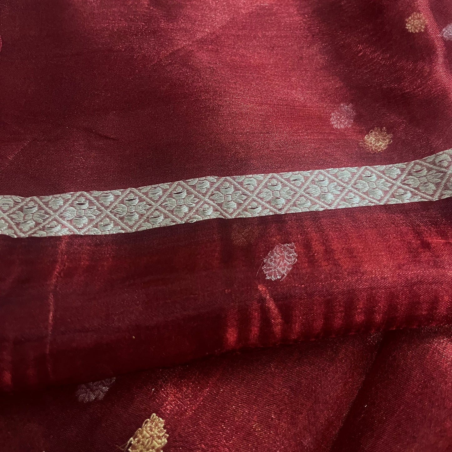 Maroon banarasi tissue silk saree with zari bootis and zari border