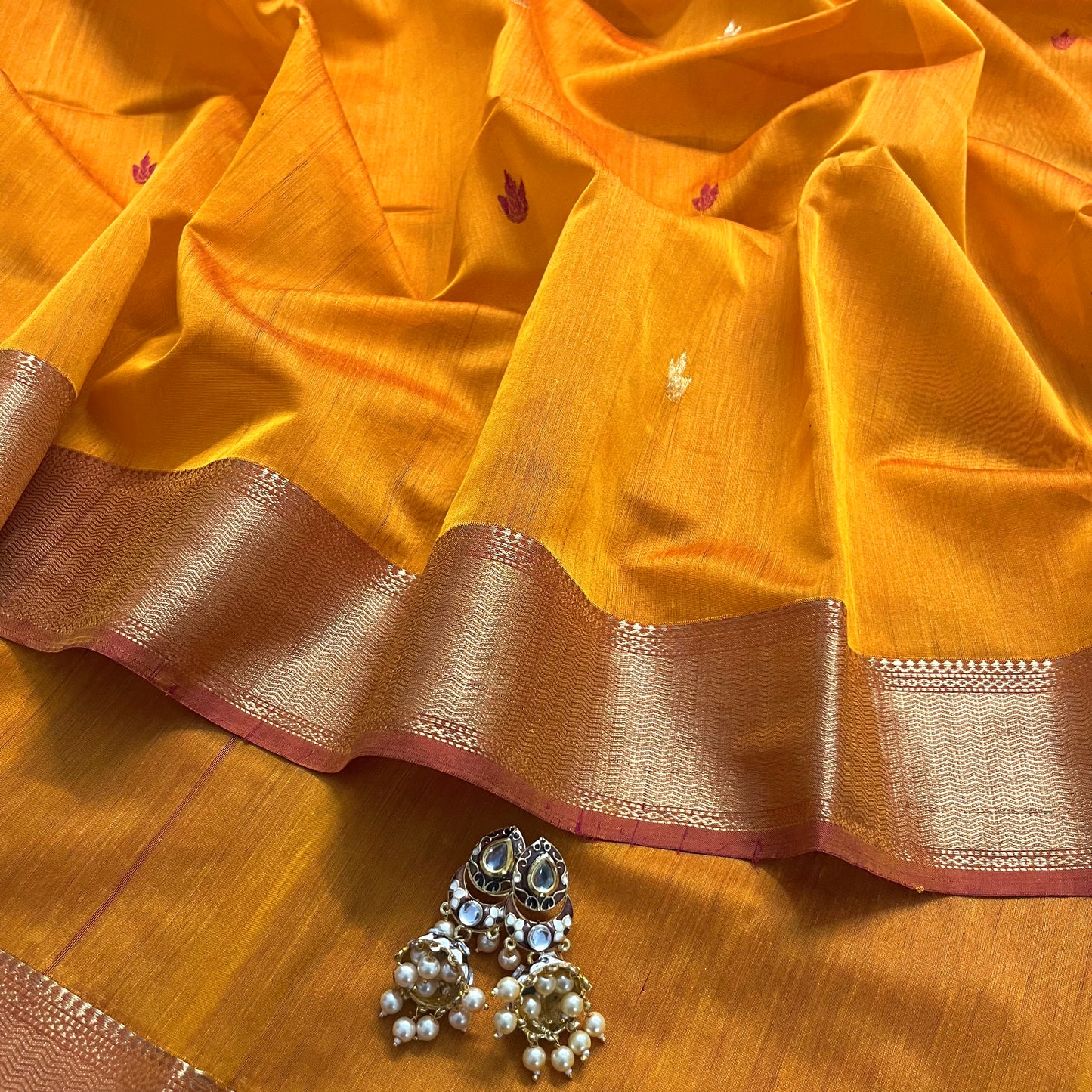 Yellow and red maheshwari saree with flower bootis all over