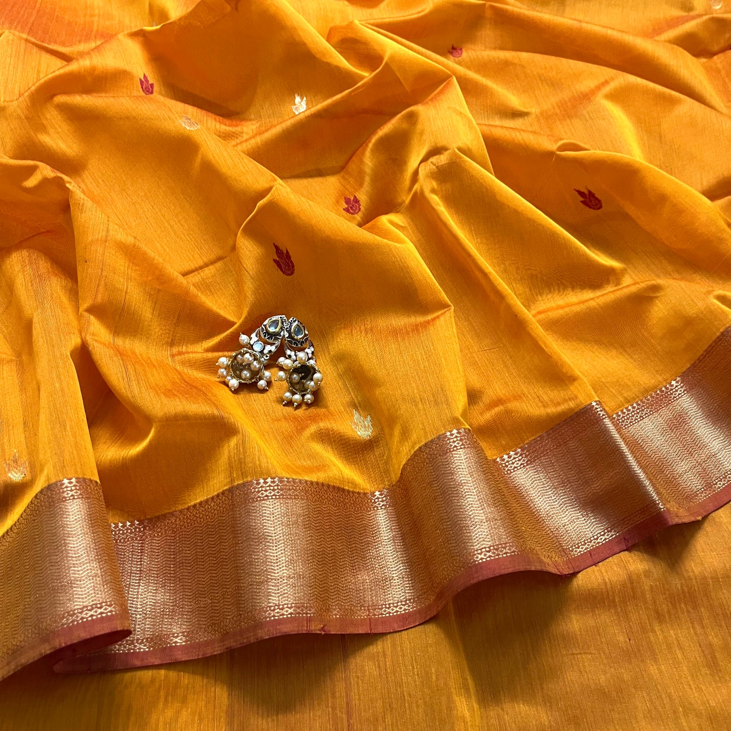 Yellow and red maheshwari saree with flower bootis all over