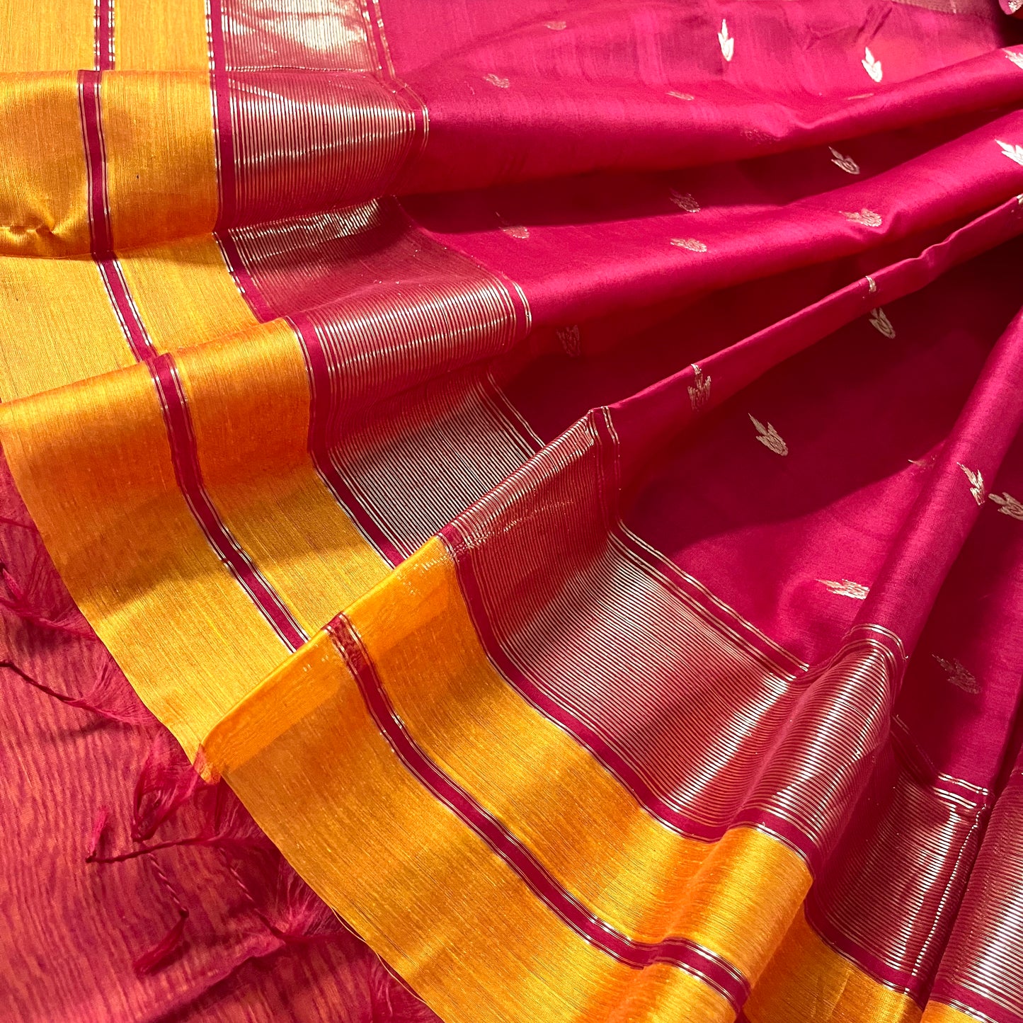 Yellow and red maheshwari saree with flower bootis all over