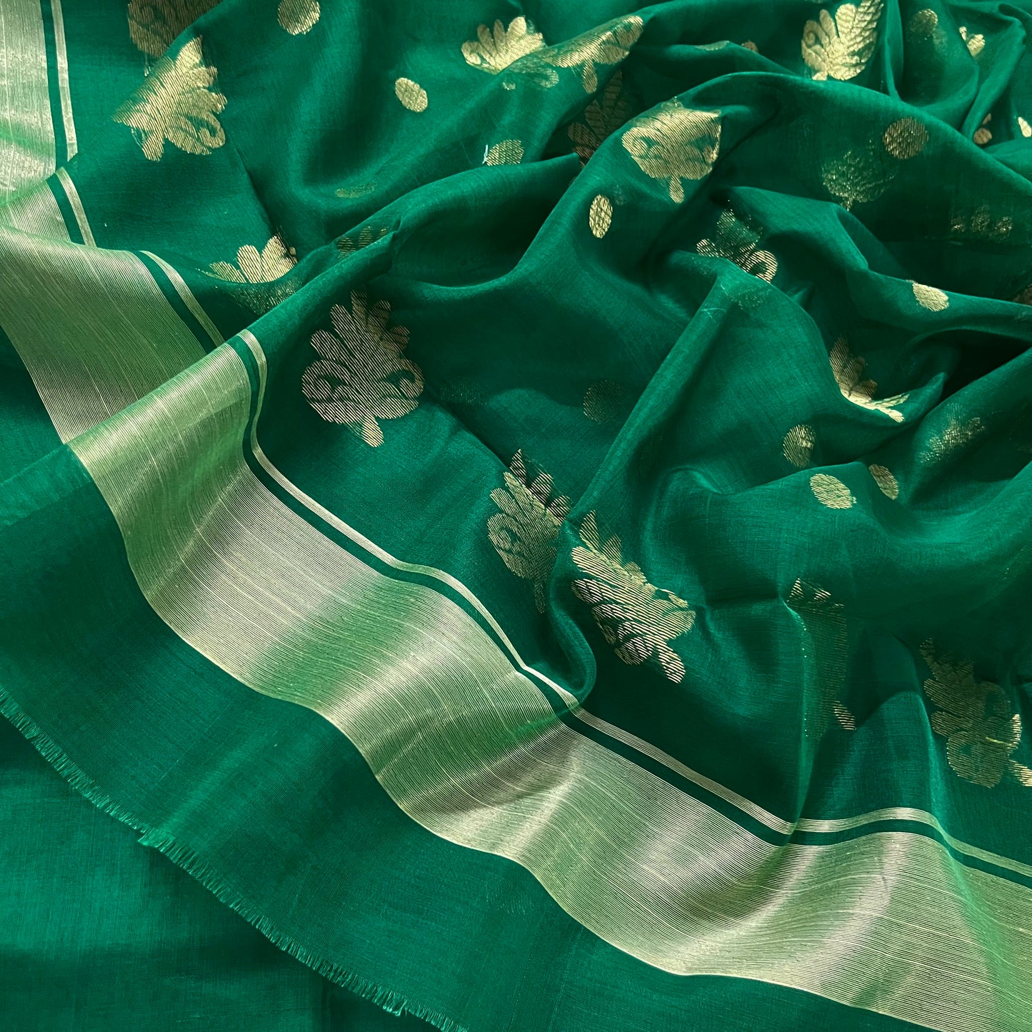 Dark green chanderi saree with zari motifs on pallu