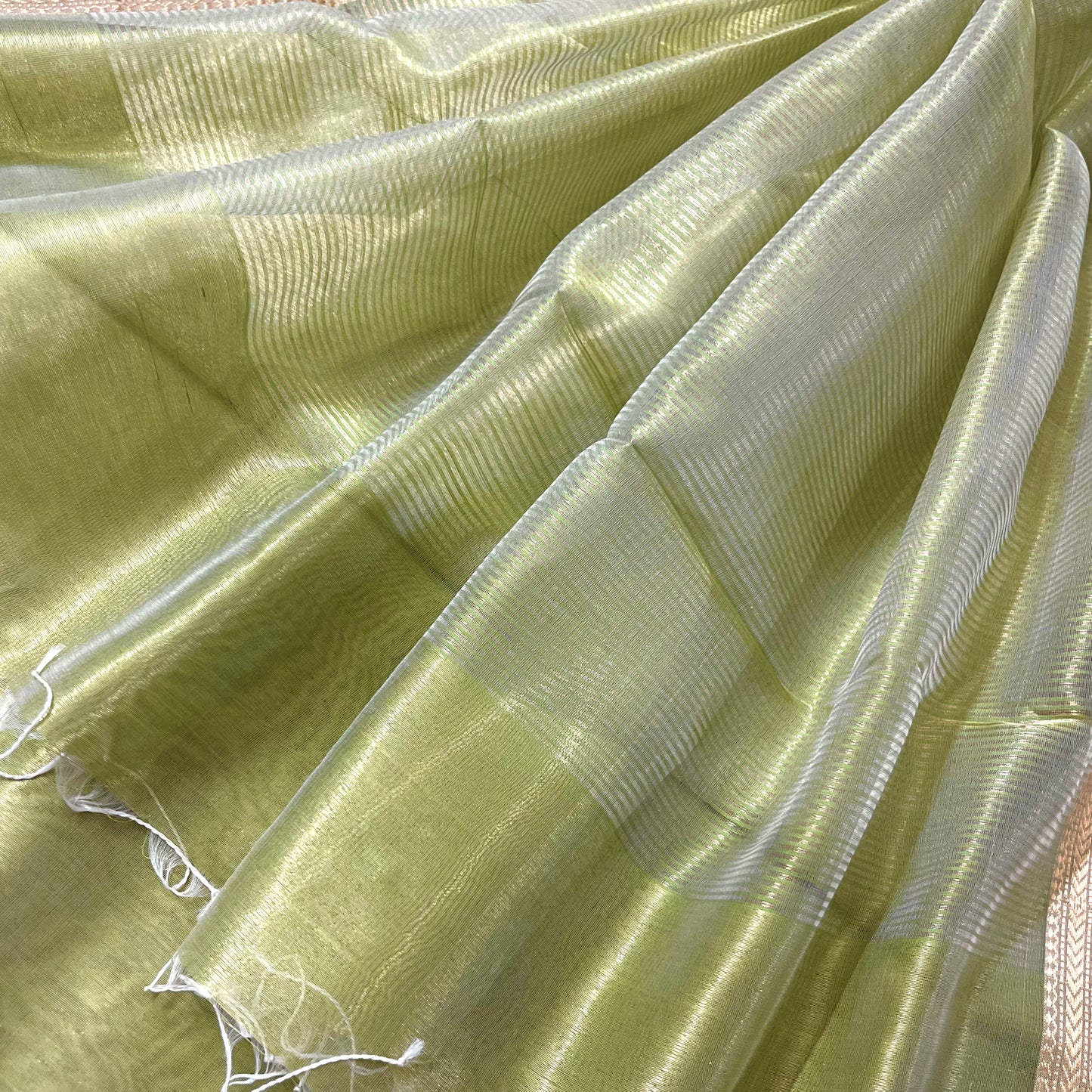 Green maheshwari tissue silk saree with flower motifs all over