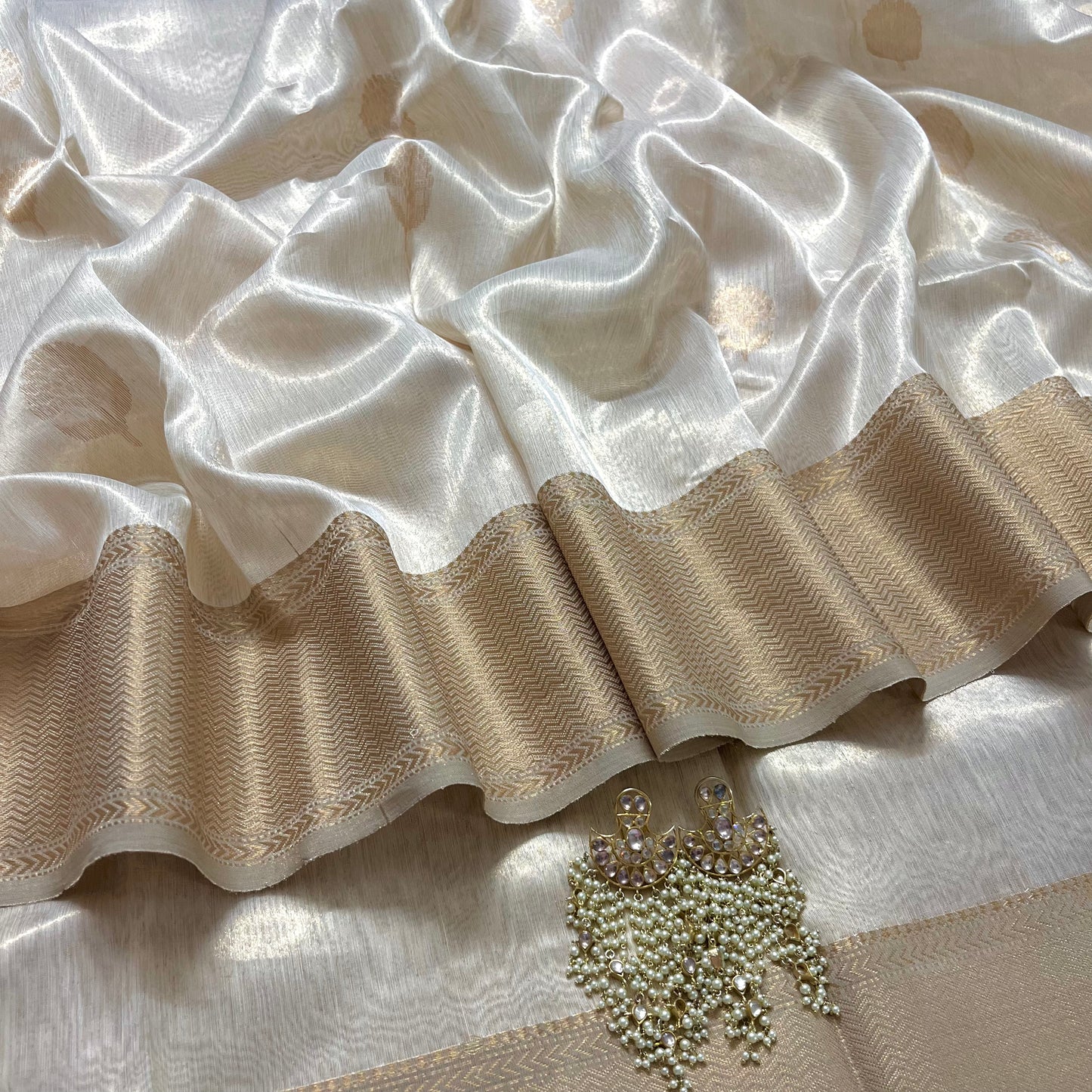 Cream gold maheshwari tissue silk saree with flower motifs all over