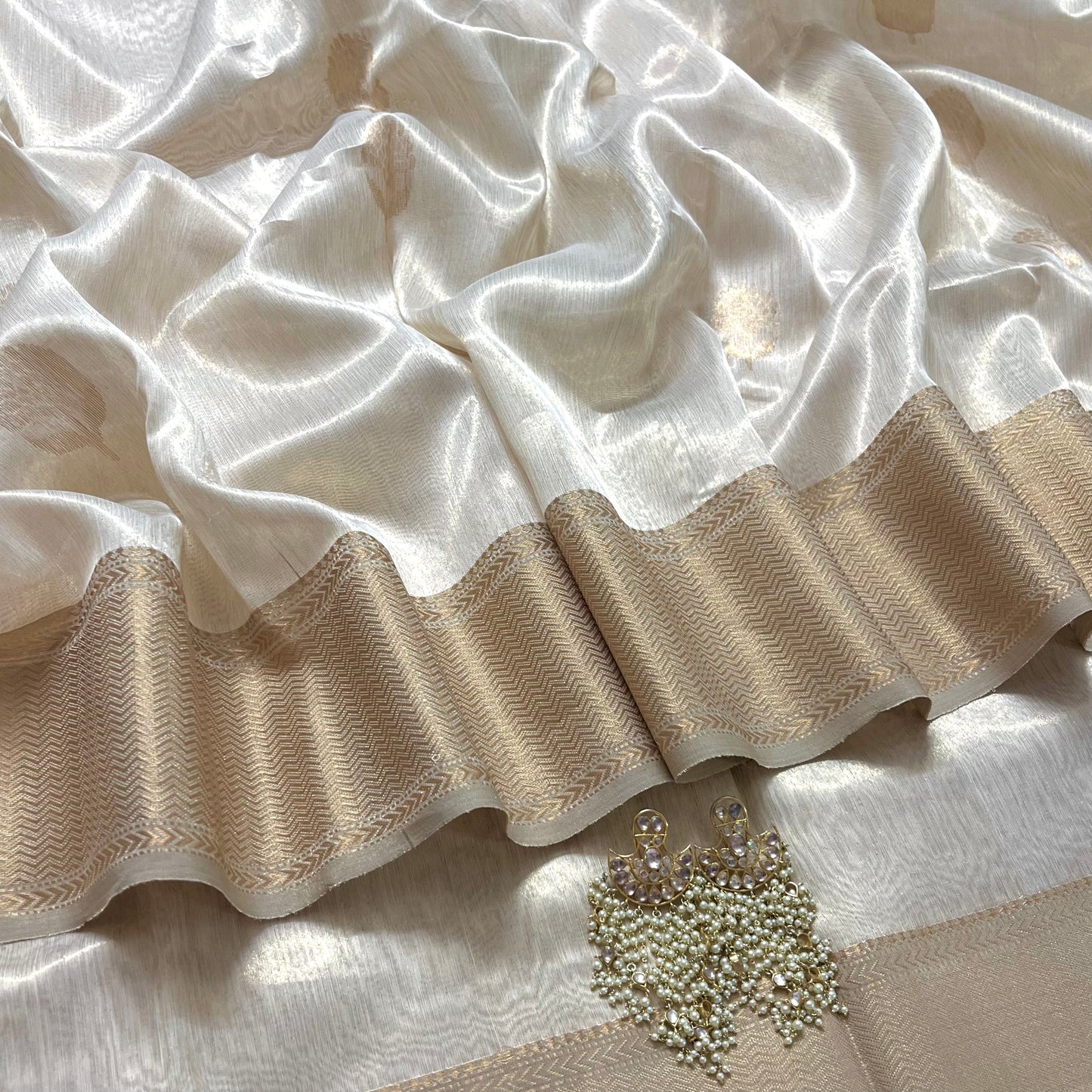 Cream gold maheshwari tissue silk saree with flower motifs all over