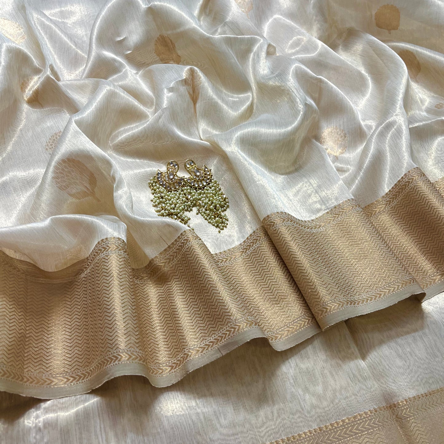 Cream gold maheshwari tissue silk saree with flower motifs all over