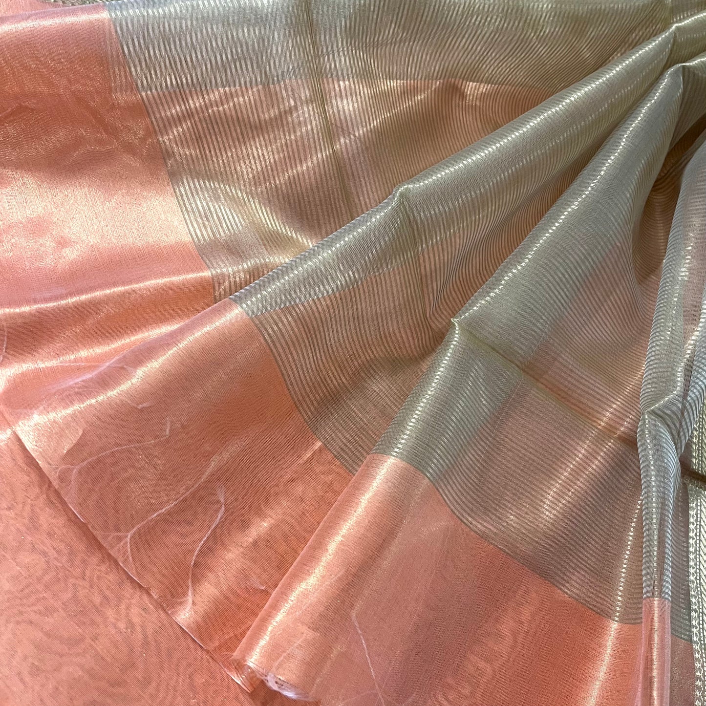 Peachish pink maheshwari tissue silk saree with flower motifs all over