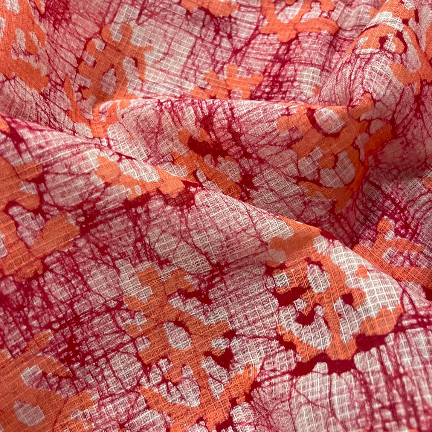 Off white, orange & red batik print saree
