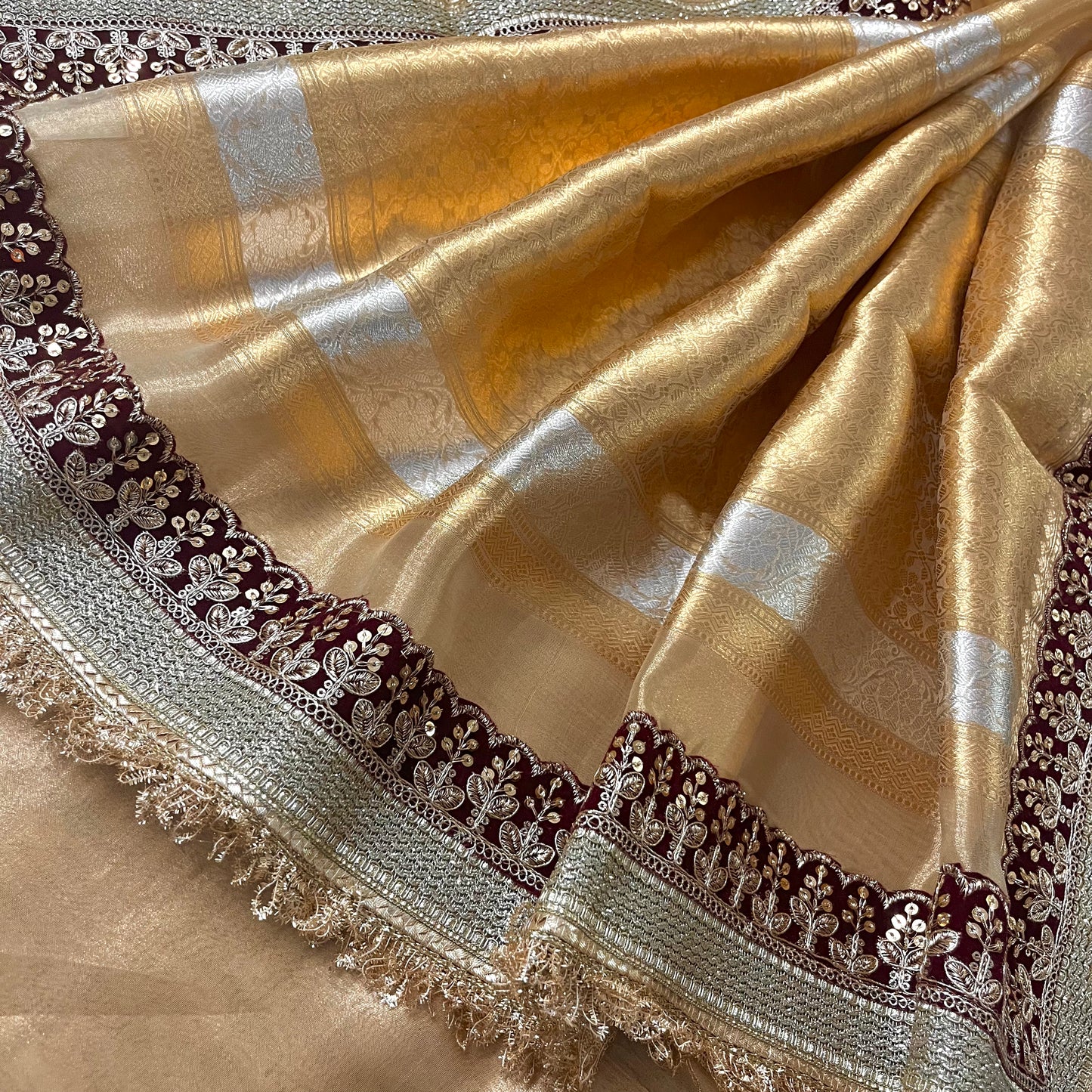 Gold and maroon banarasi tissue silk saree with zari bootis and zari border