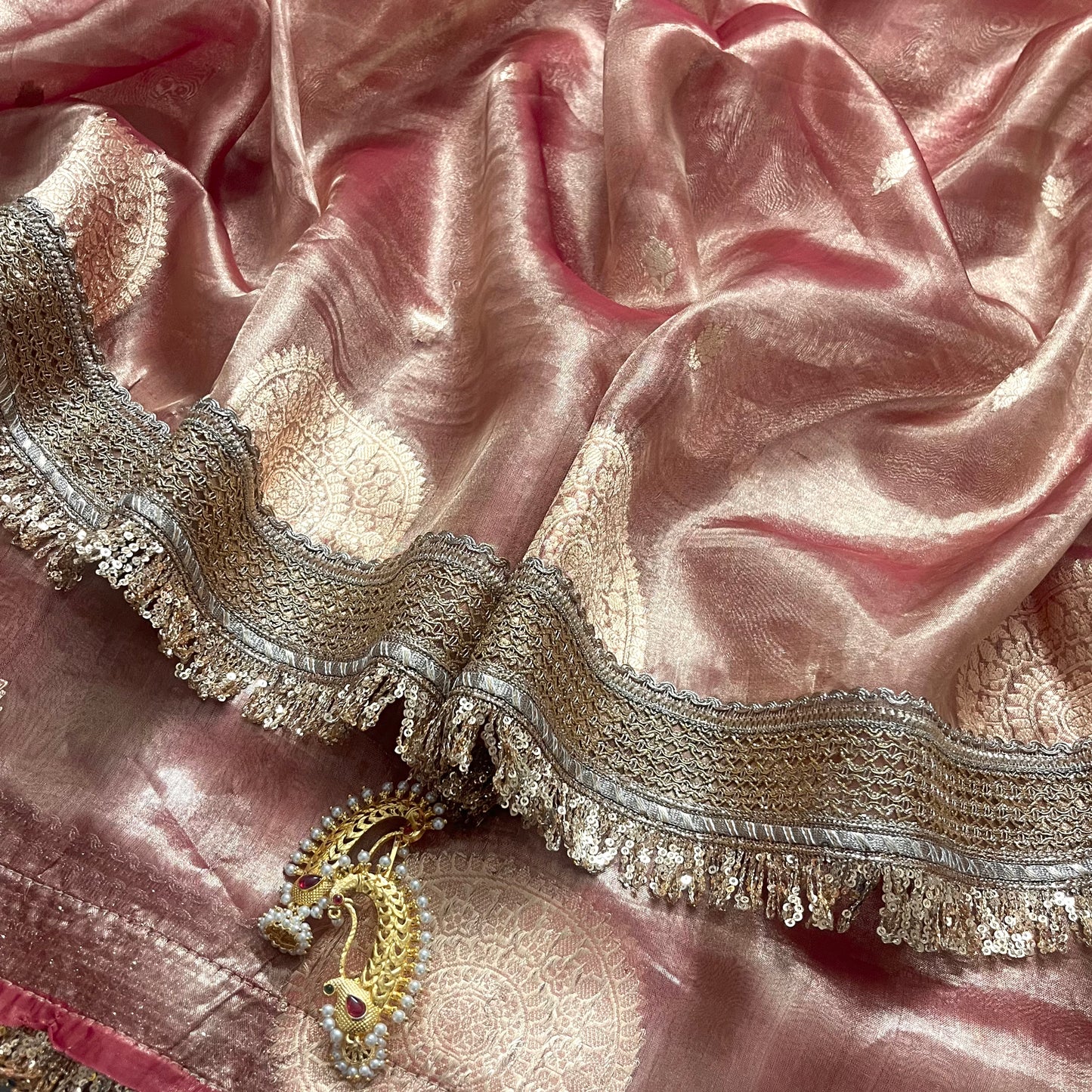 Peachish pink banarasi tissue silk saree with zari bootis and zari border