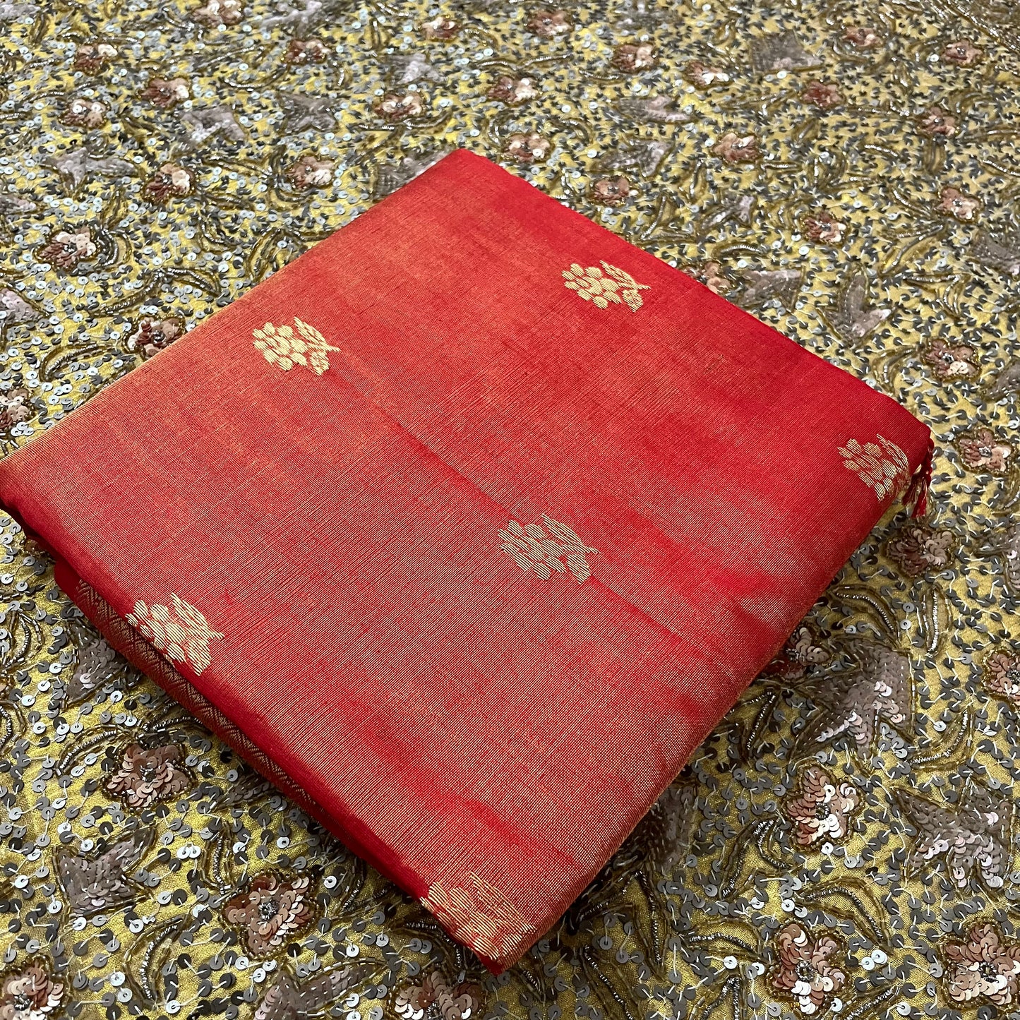 Red maheshwari tissue silk saree with flower motifs all over