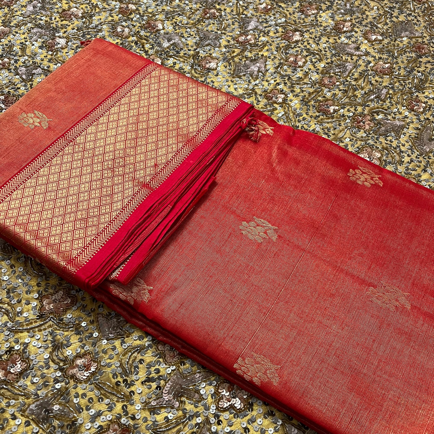 Red maheshwari tissue silk saree with flower motifs all over