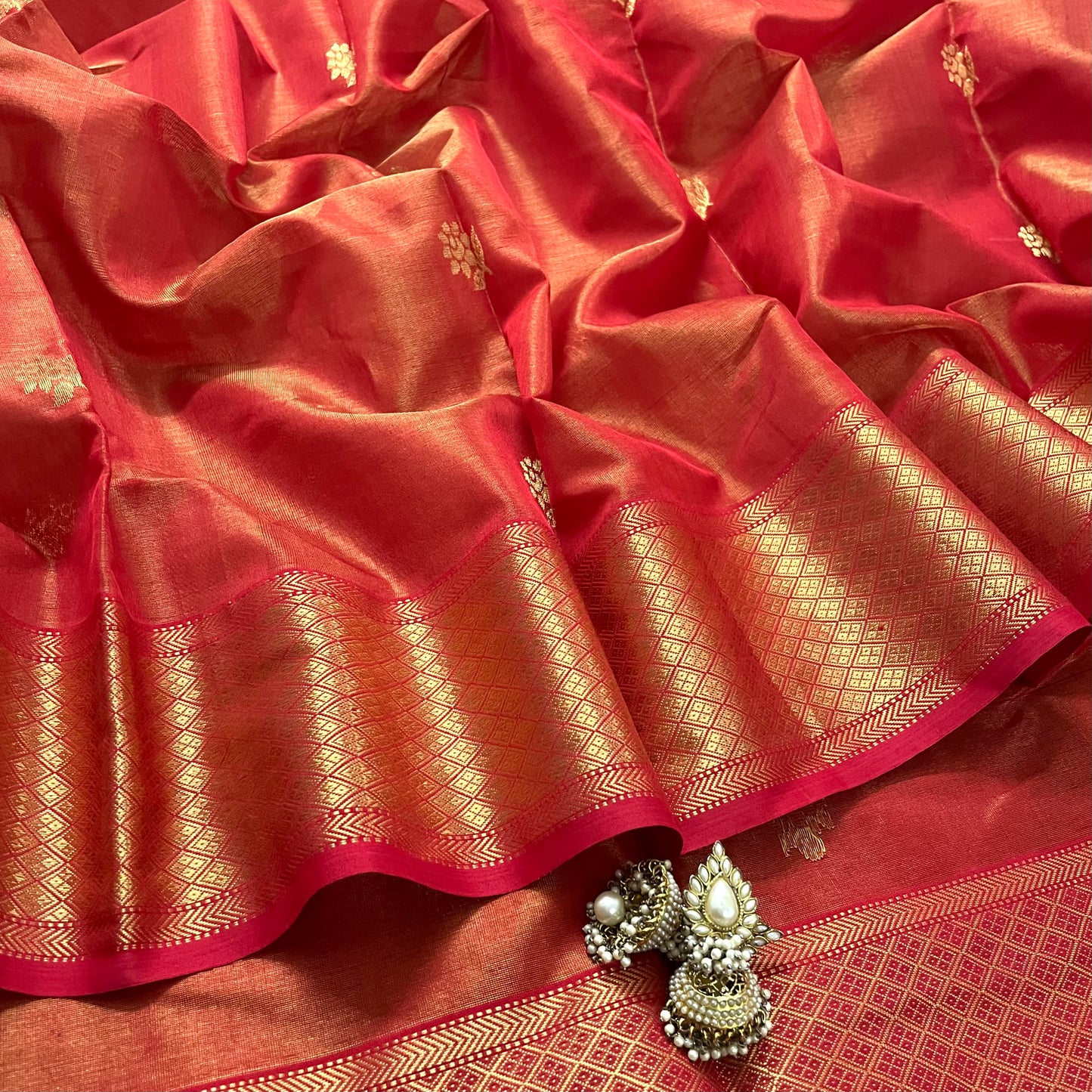 Red maheshwari tissue silk saree with flower motifs all over