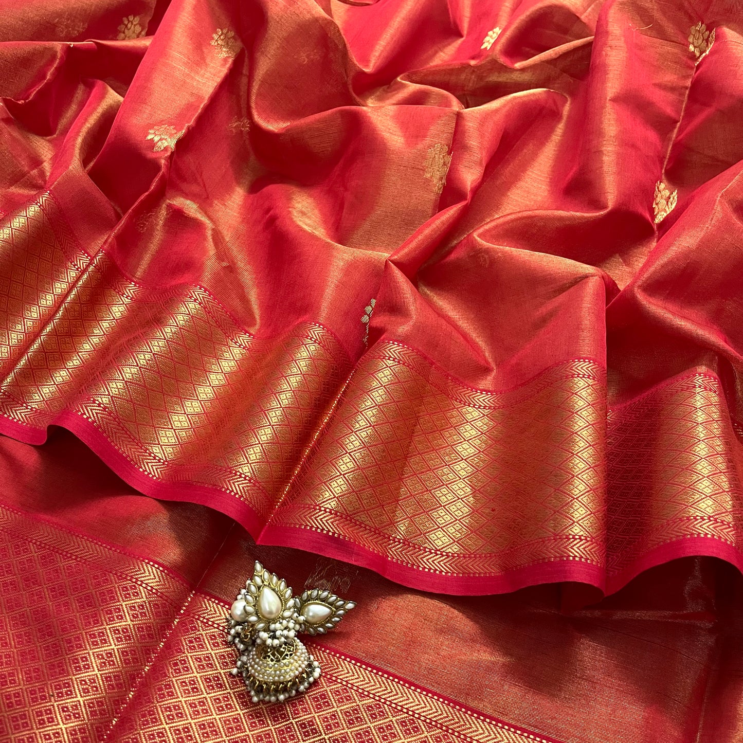 Red maheshwari tissue silk saree with flower motifs all over