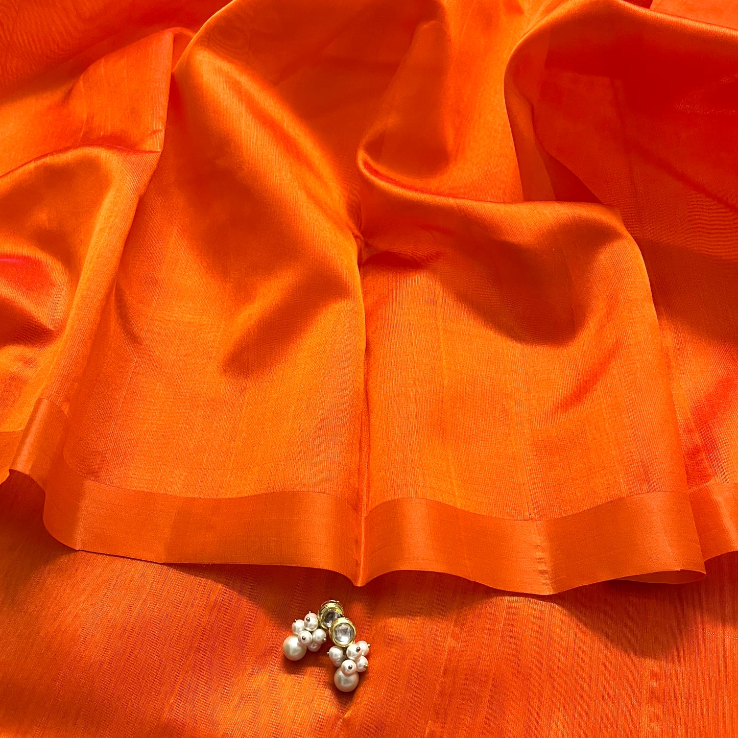 Sunset orange chanderi silk saree with silk border