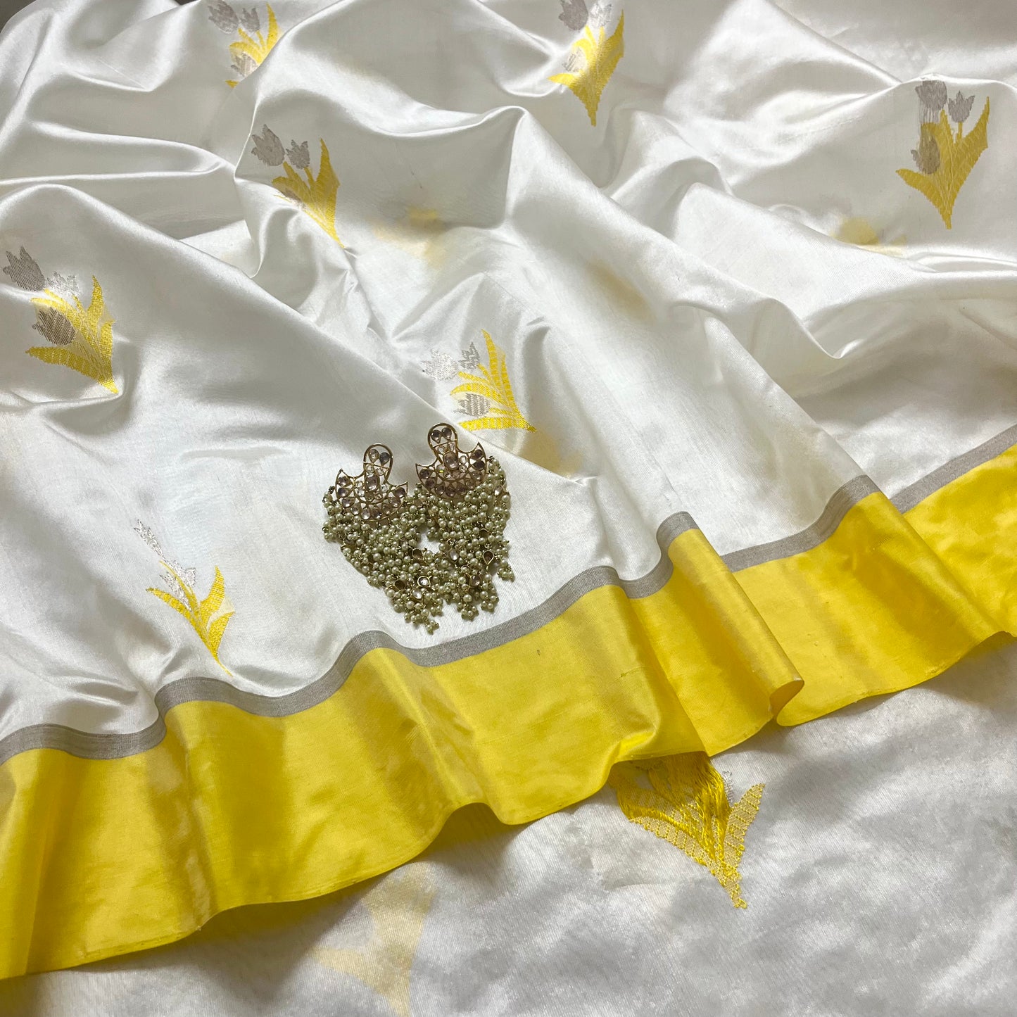 White and yellow chanderi silk saree with zari motifs all over