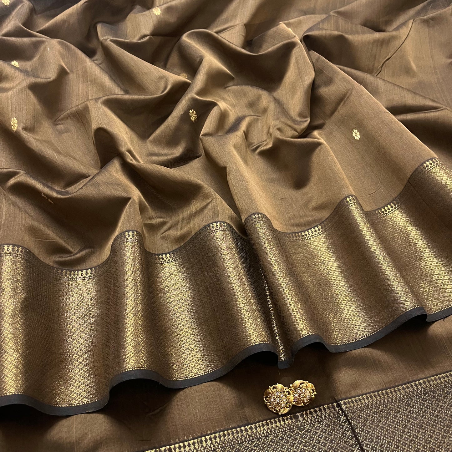 Brown maheshwari saree with flower bootis all over