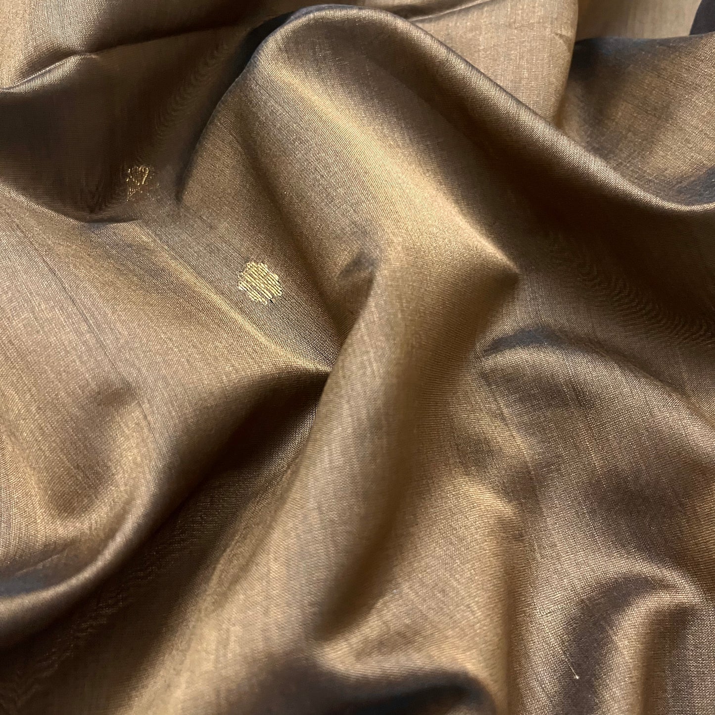 Brown maheshwari saree with flower bootis all over