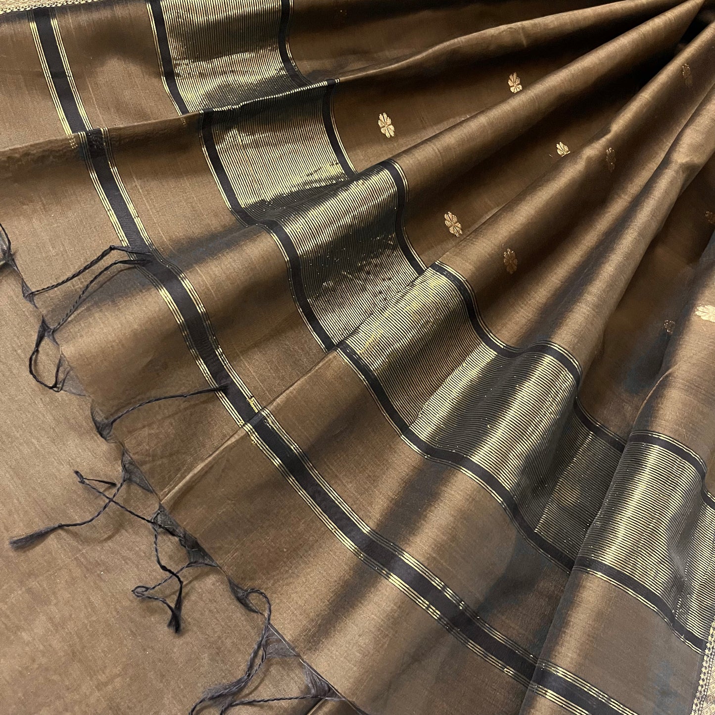 Brown maheshwari saree with flower bootis all over