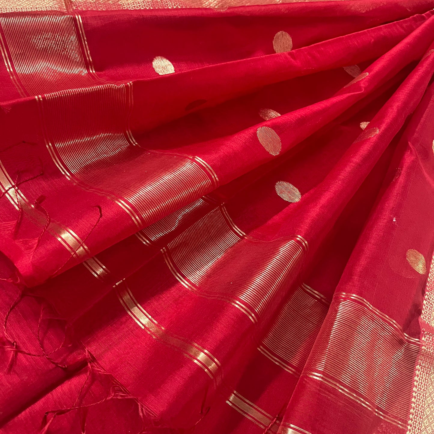 Red maheshwari saree with zari bootis all over