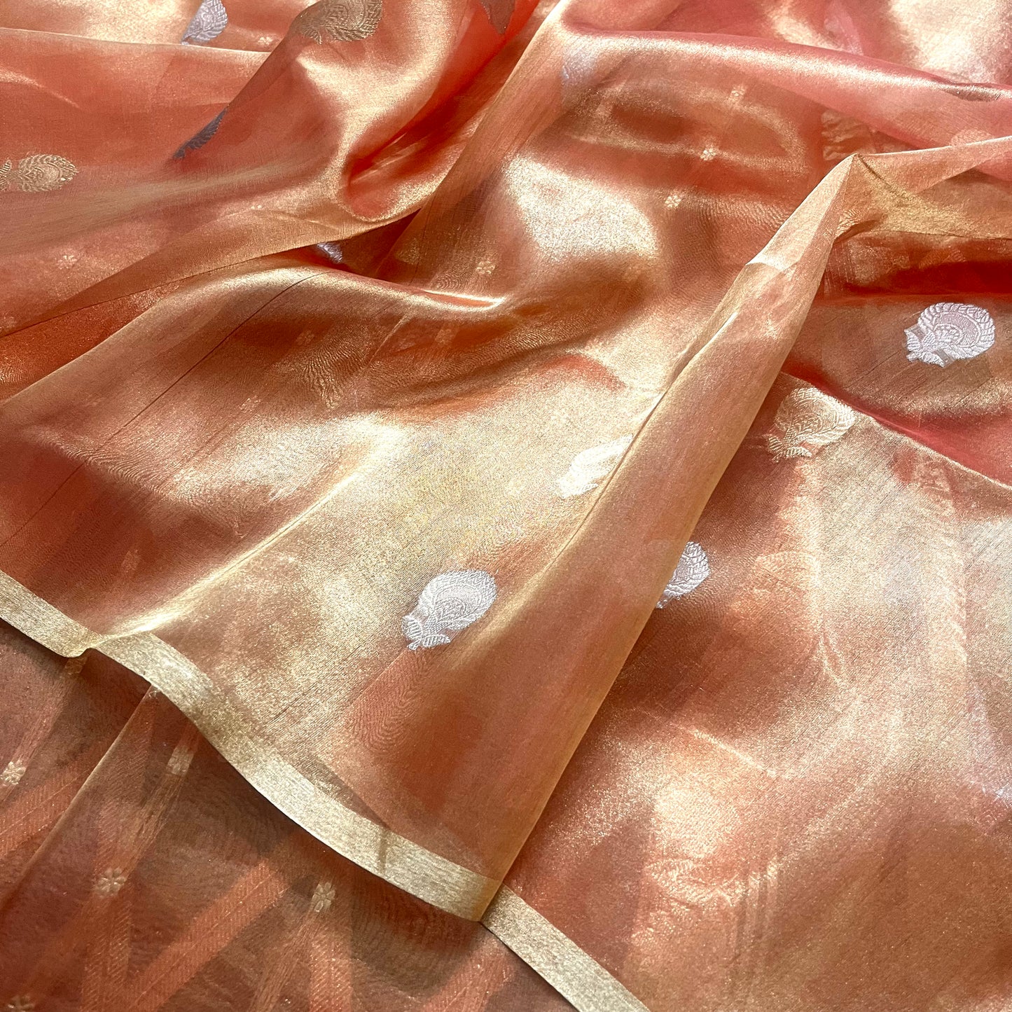 Peach banarasi tissue silk saree with zari pattern all over