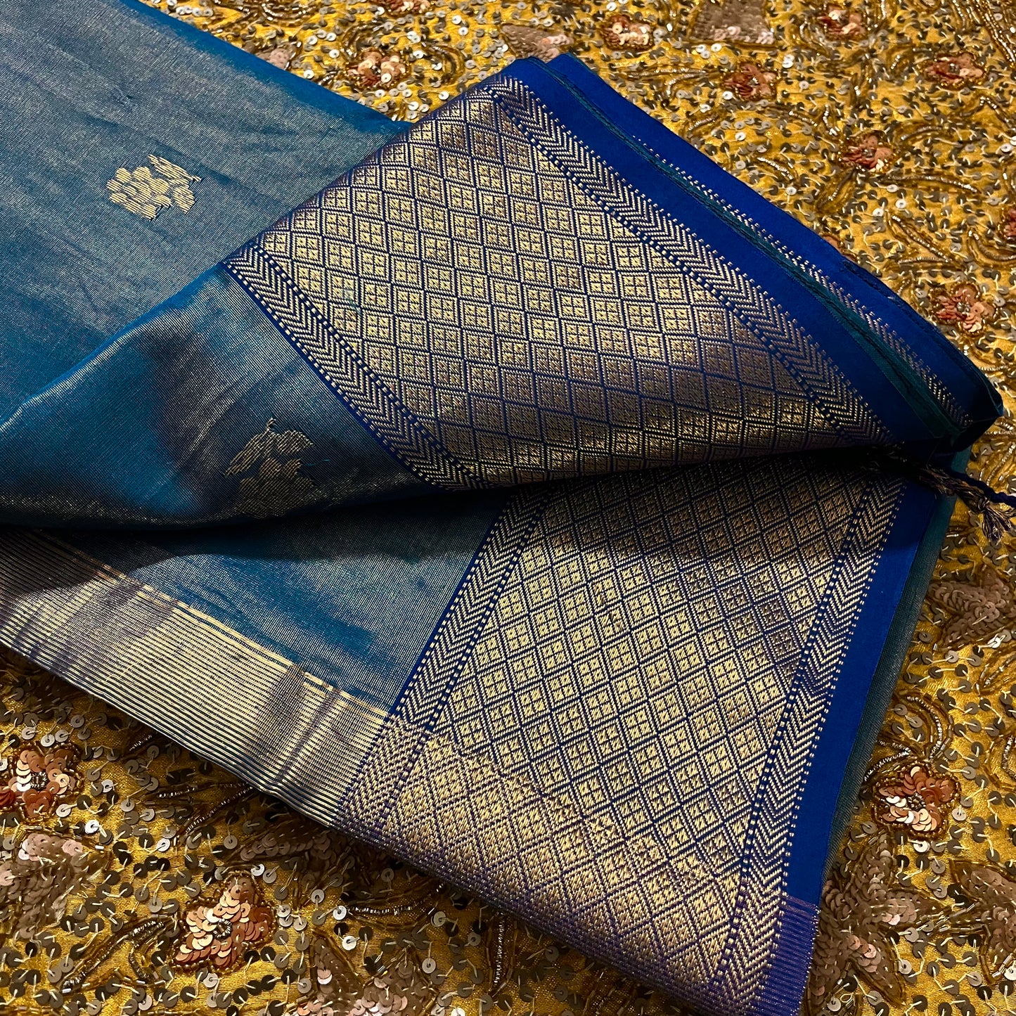 Ink blue maheshwari tissue silk saree with flower motifs all over