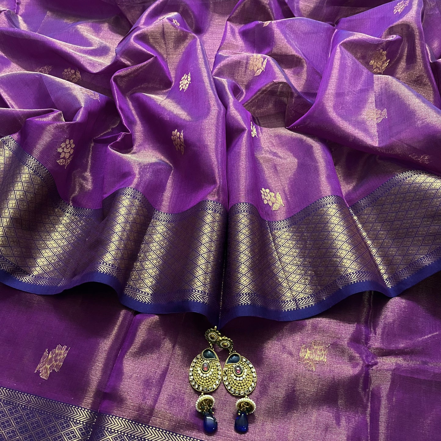 Violet maheshwari tissue silk saree with flower motifs all over