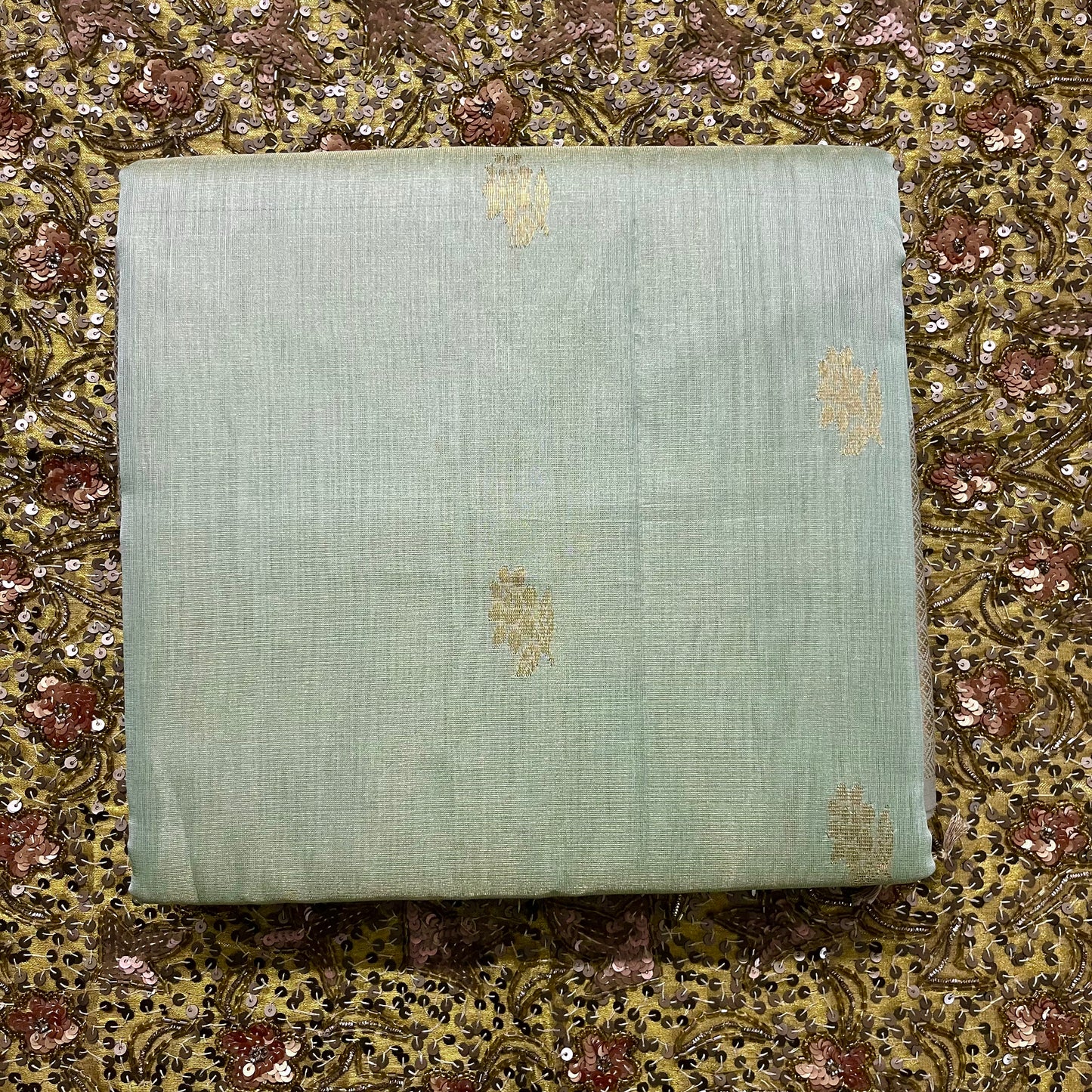 Sage green maheshwari tissue silk saree with flower motifs all over