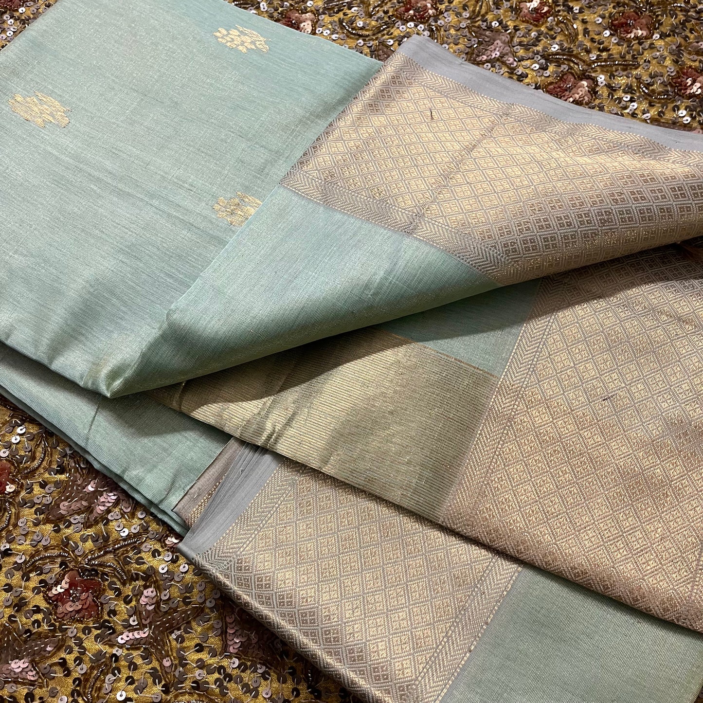 Sage green maheshwari tissue silk saree with flower motifs all over