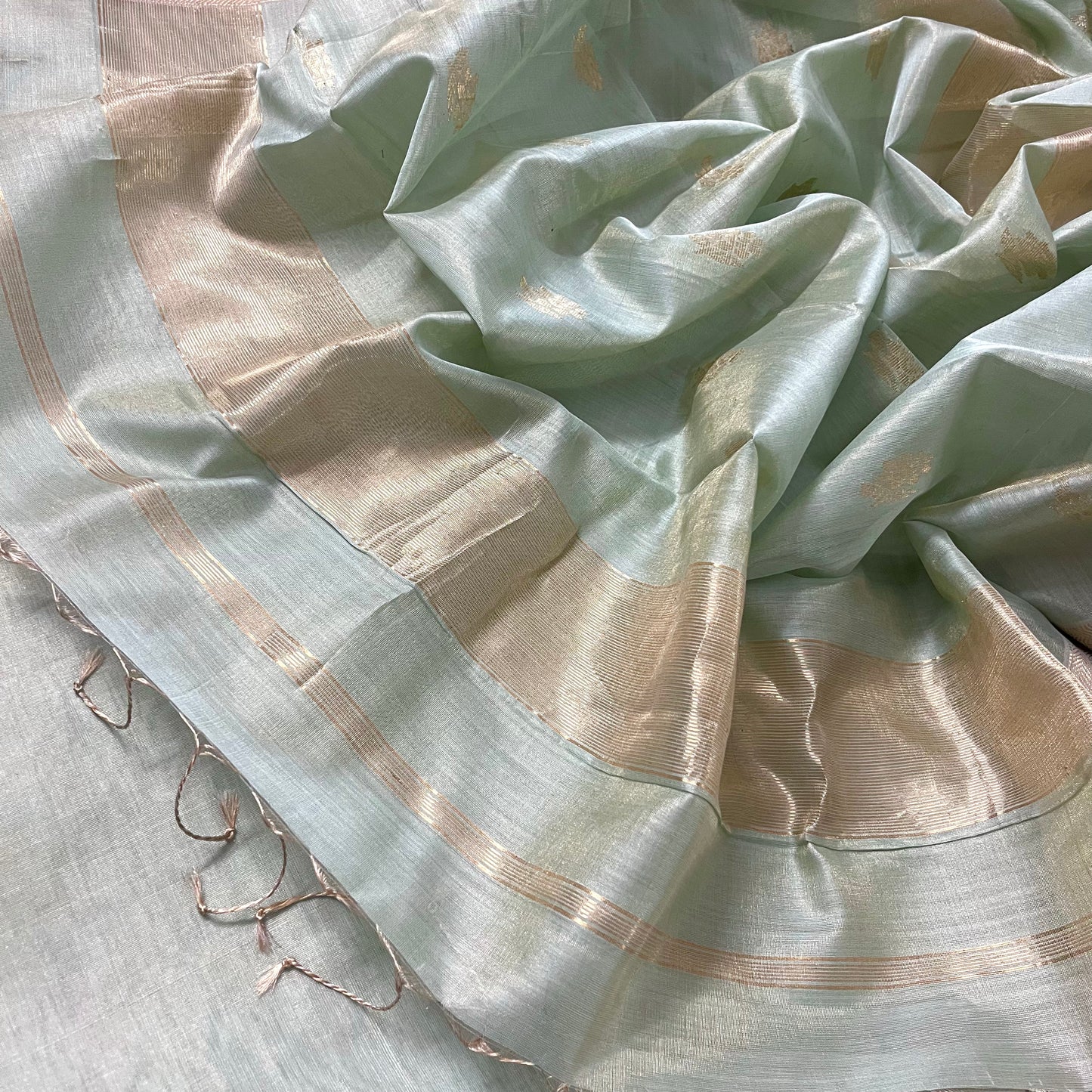 Sage green maheshwari tissue silk saree with flower motifs all over