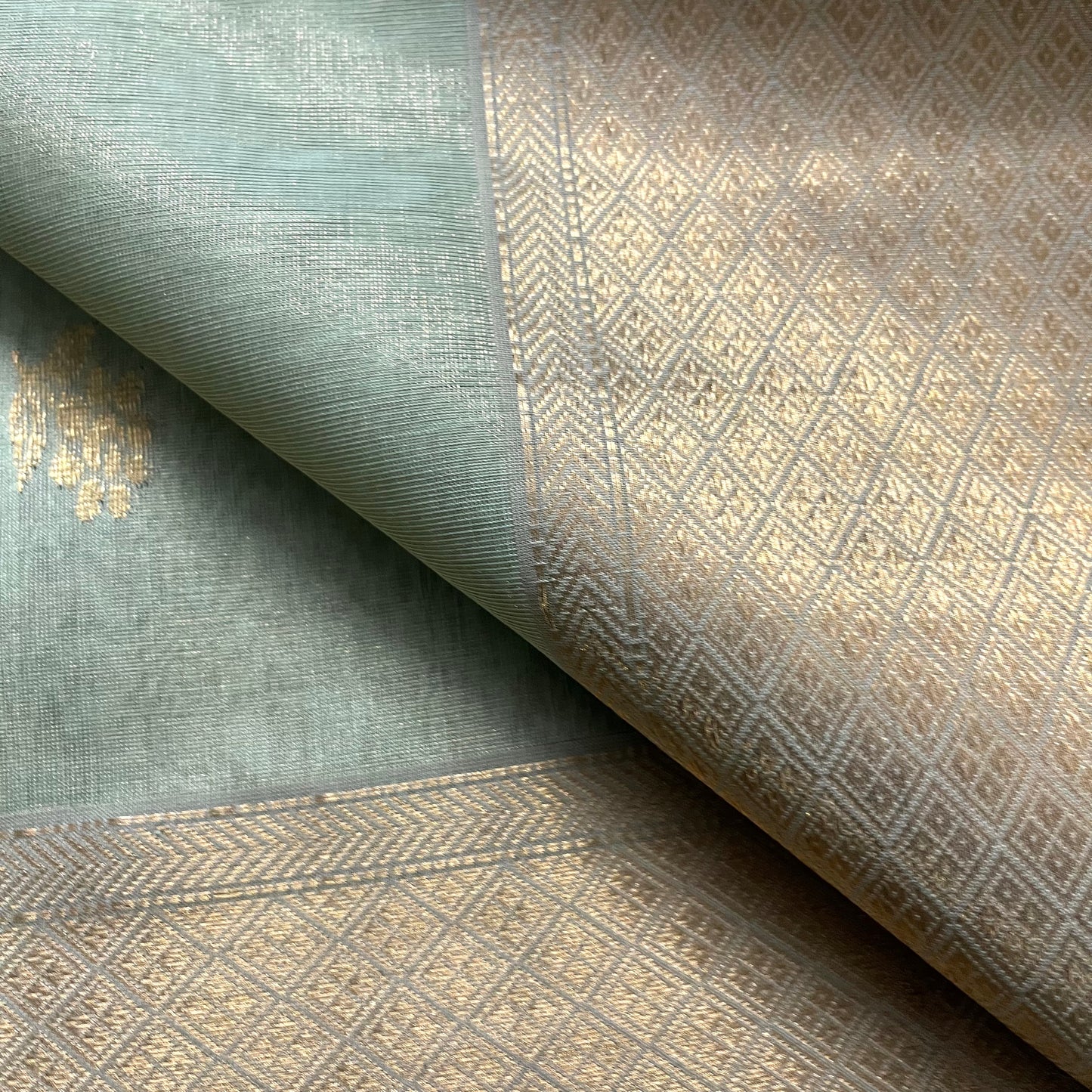 Sage green maheshwari tissue silk saree with flower motifs all over