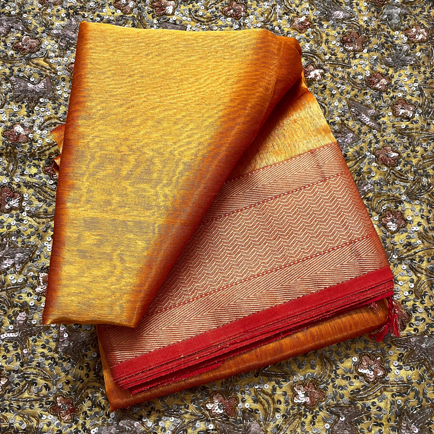 Mustard and red maheshwari tissue silk with zari pattern on pallu