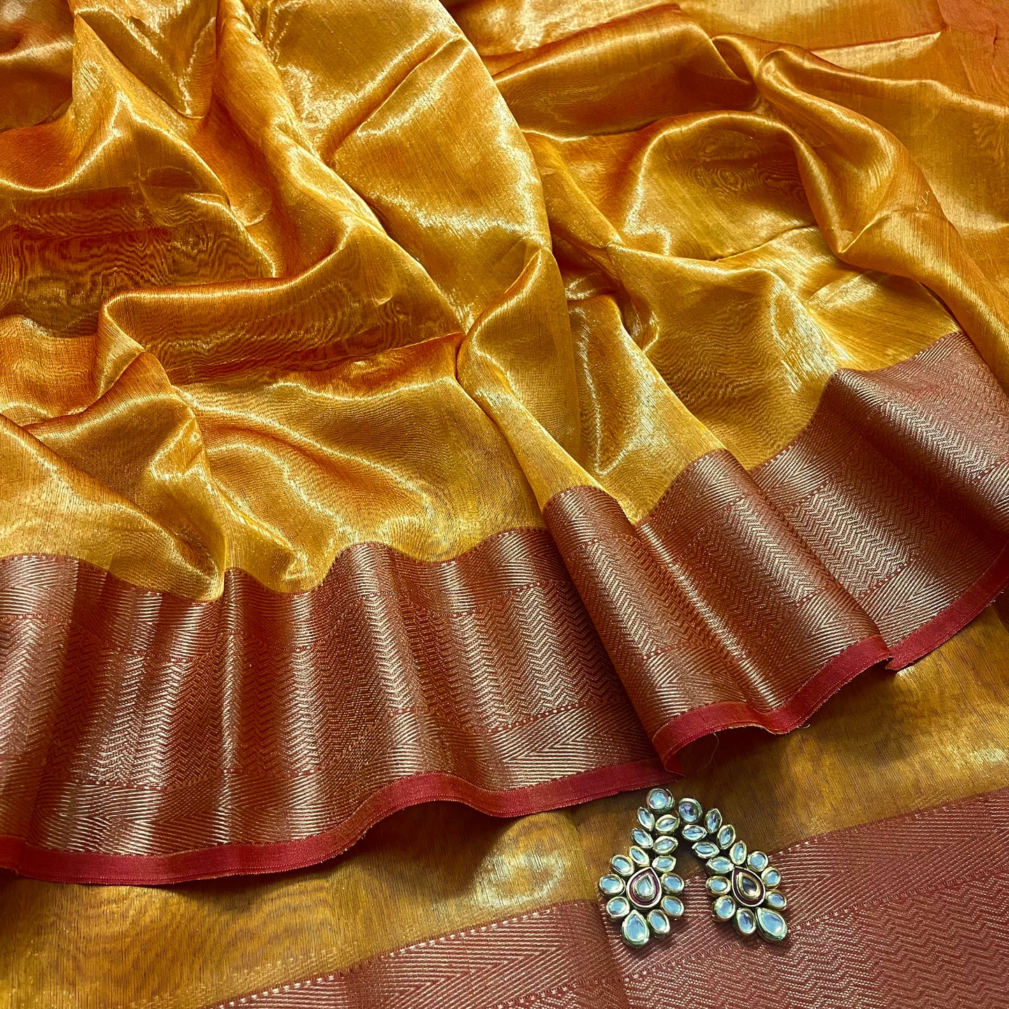 Mustard and red maheshwari tissue silk with zari pattern on pallu