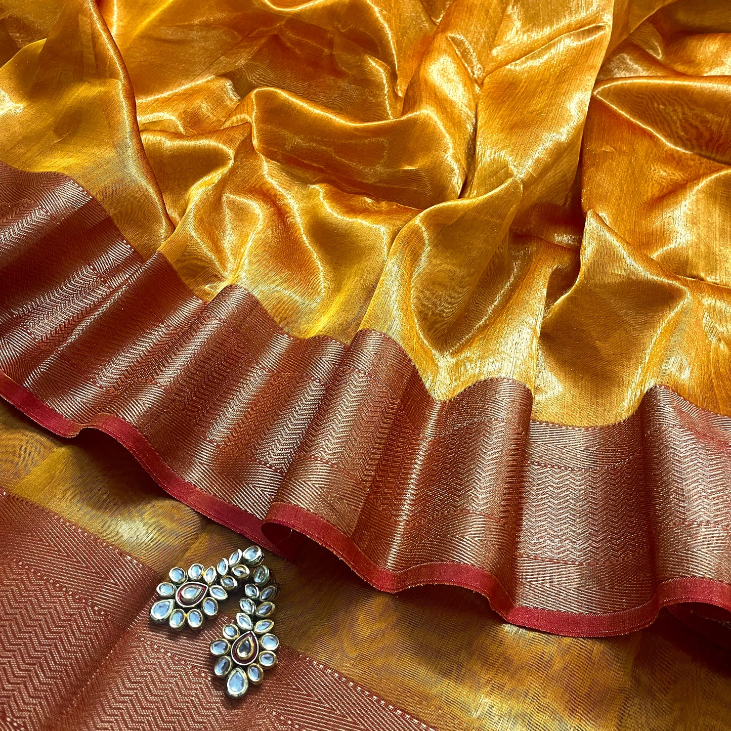 Mustard and red maheshwari tissue silk with zari pattern on pallu