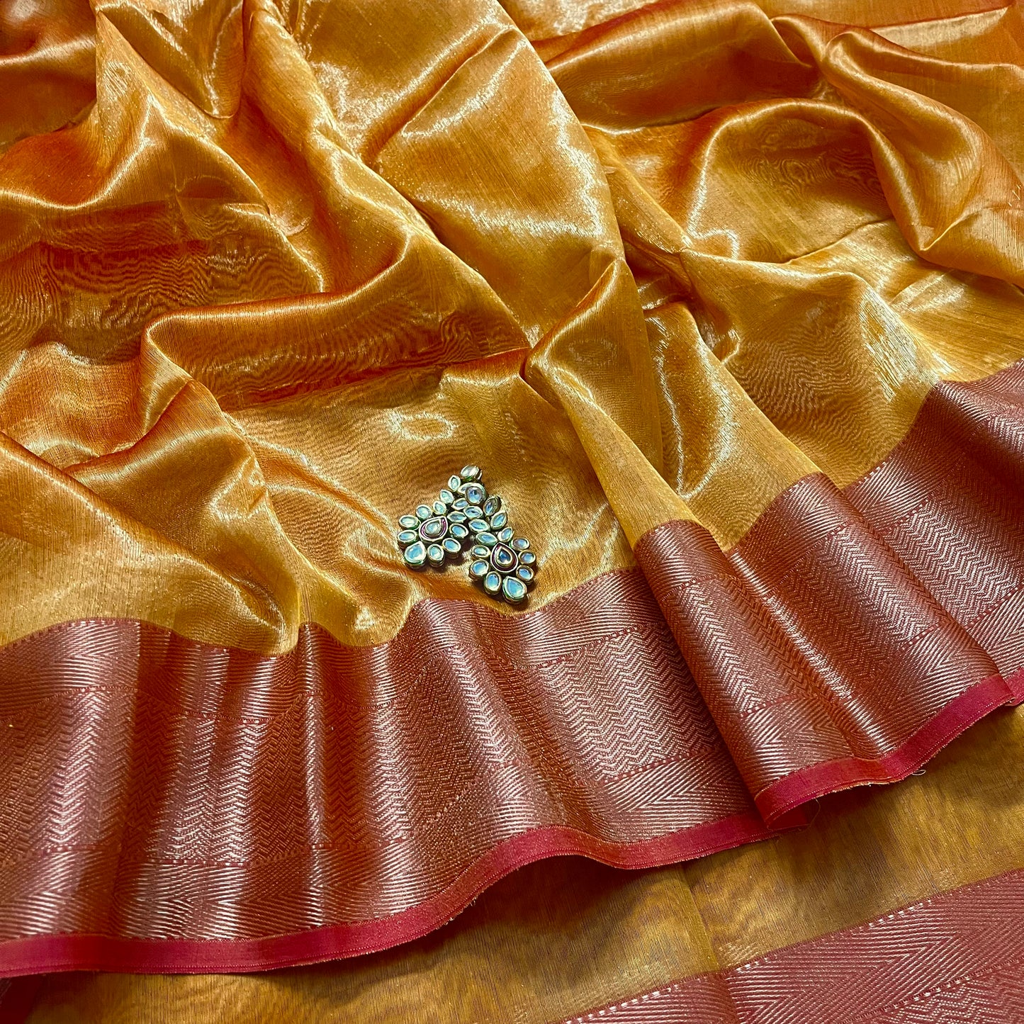 Mustard and red maheshwari tissue silk with zari pattern on pallu