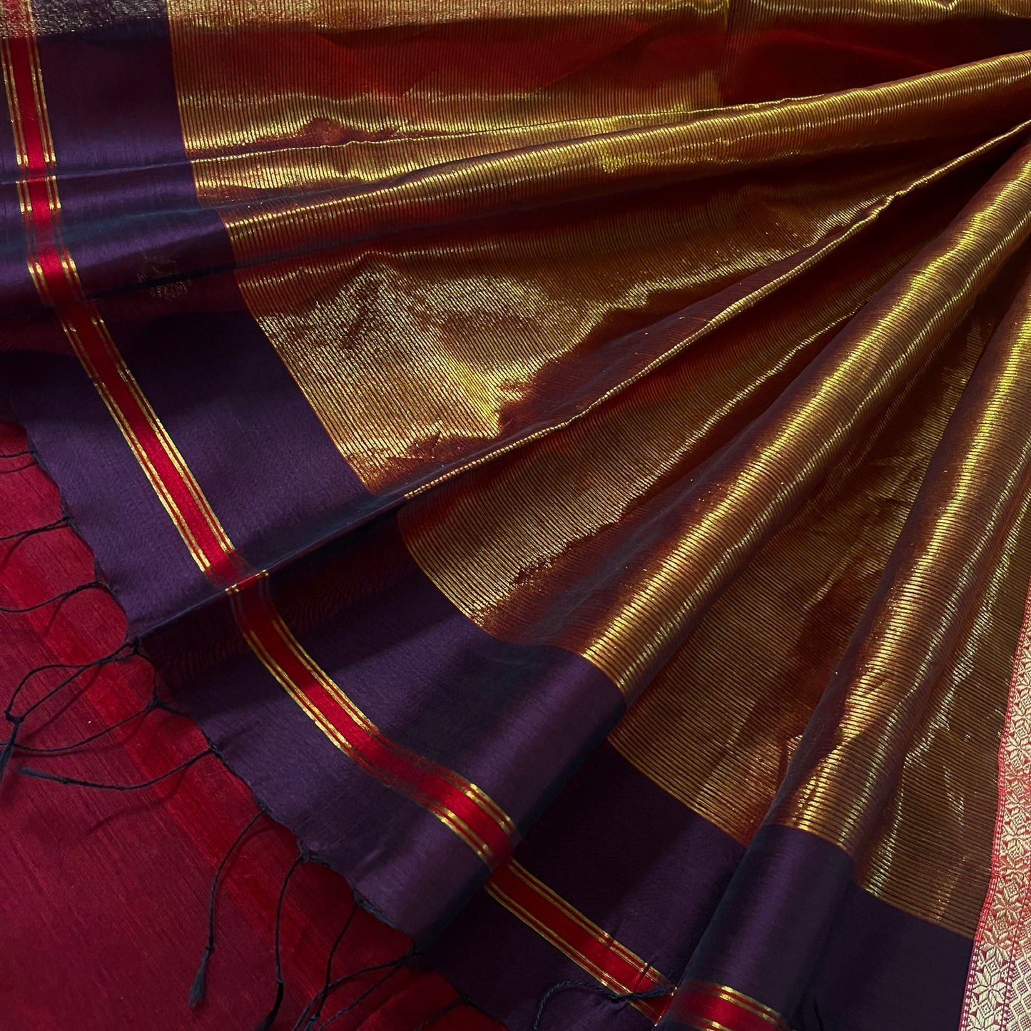 Wine and red maheshwari saree with flower motifs all over