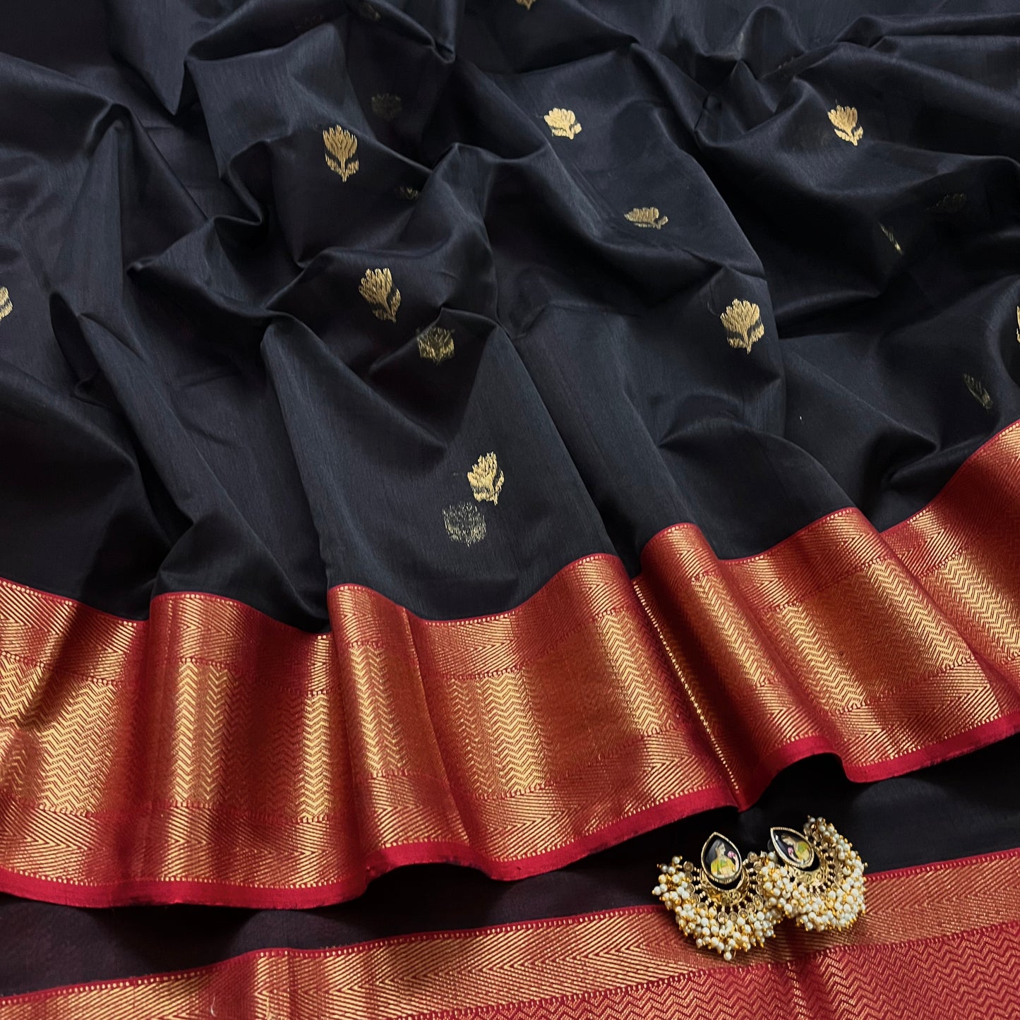 Black and red maheshwari saree with flower motifs all over