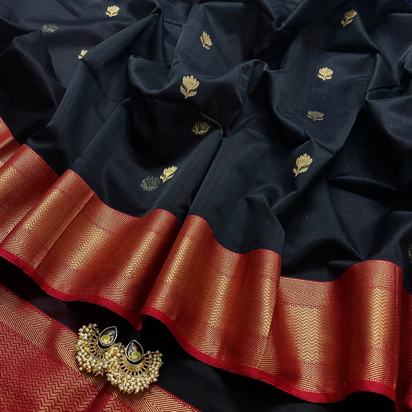 Black and red maheshwari saree with flower motifs all over