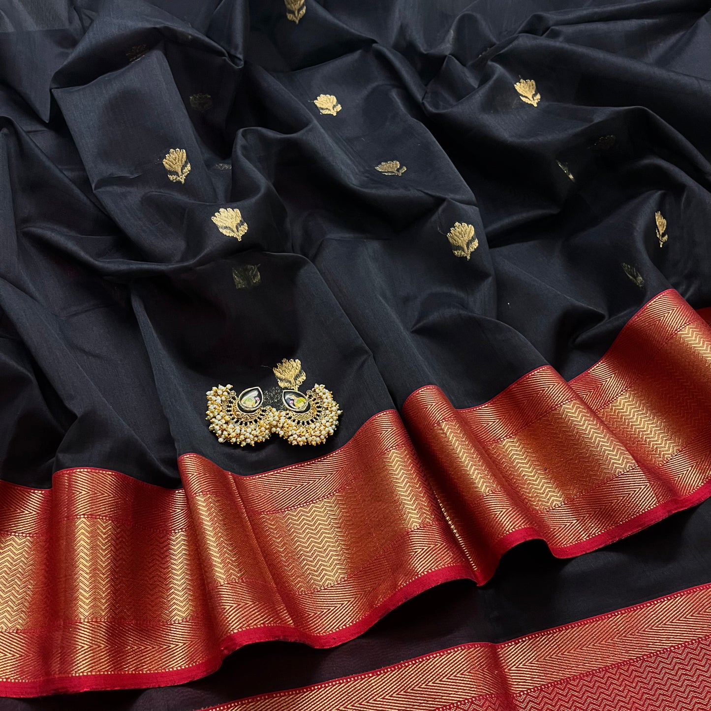 Black and red maheshwari saree with flower motifs all over