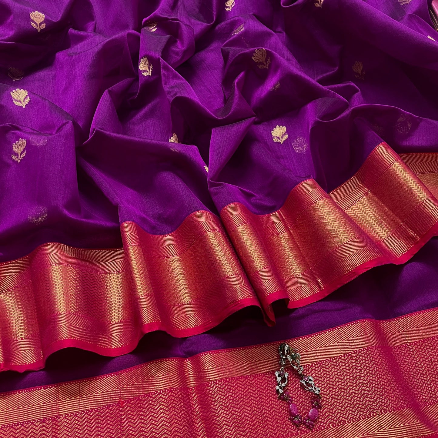 Violet and red maheshwari saree with flower motifs all over