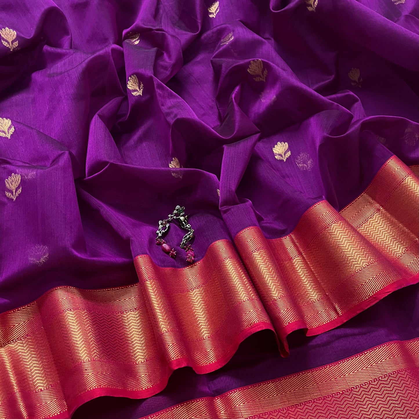 Violet and red maheshwari saree with flower motifs all over