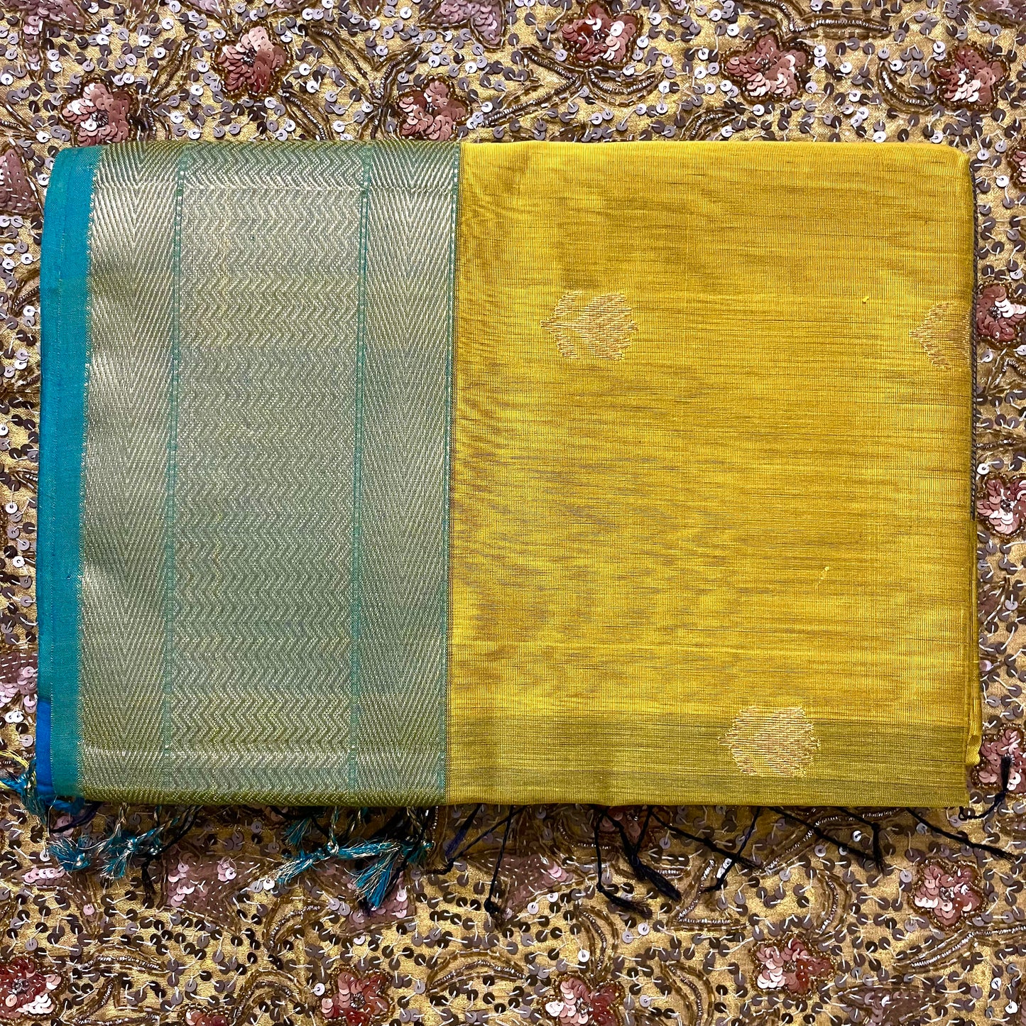 Mustard and blue maheshwari saree with flower motifs all over