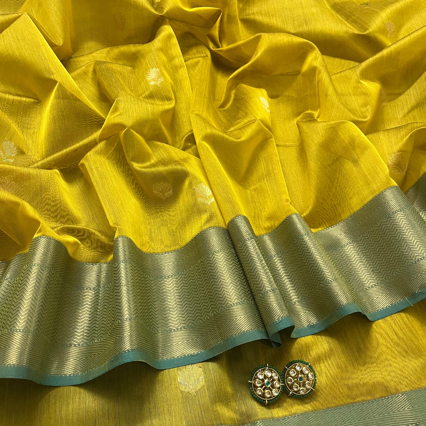 Mustard and blue maheshwari saree with flower motifs all over