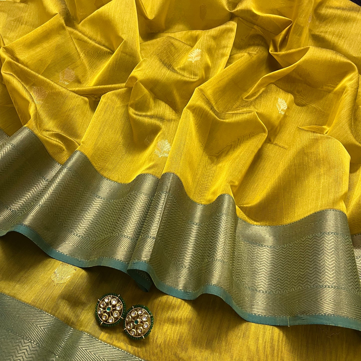 Mustard and blue maheshwari saree with flower motifs all over