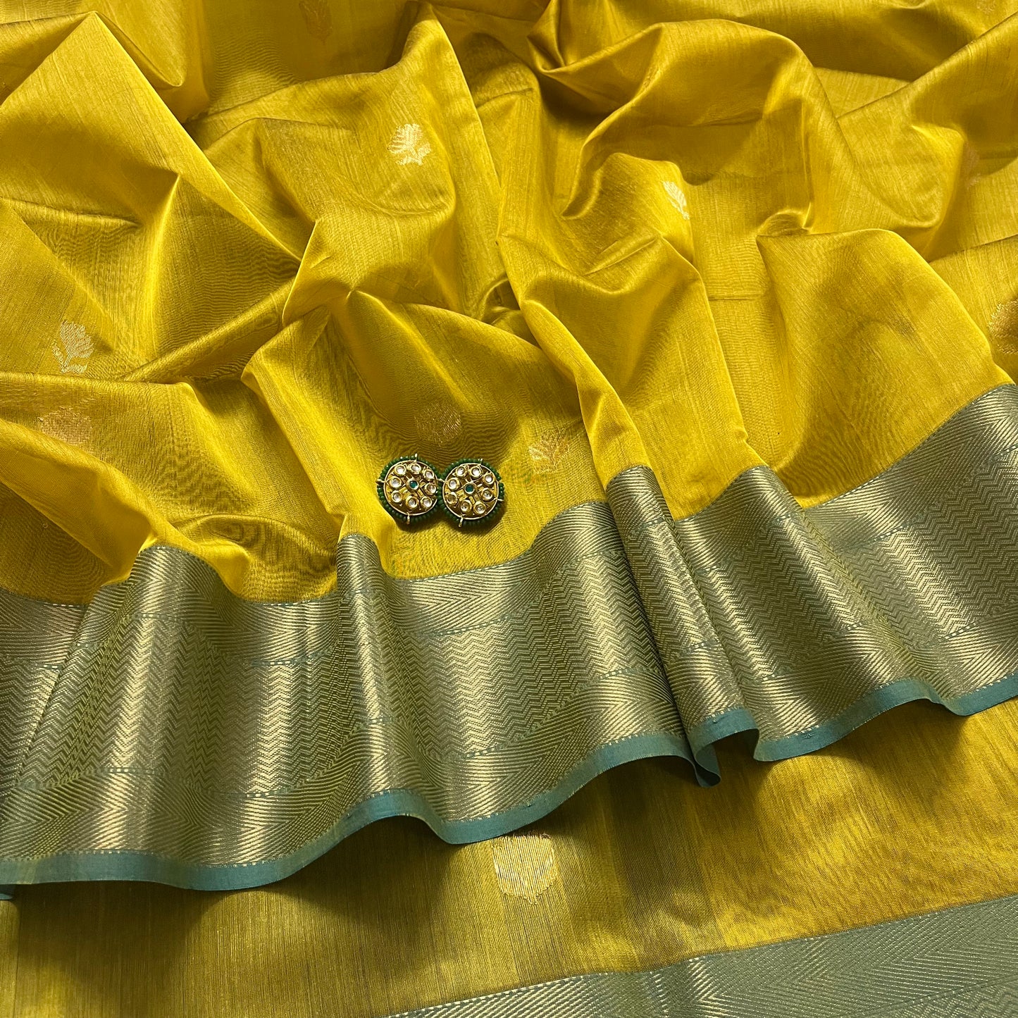 Mustard and blue maheshwari saree with flower motifs all over