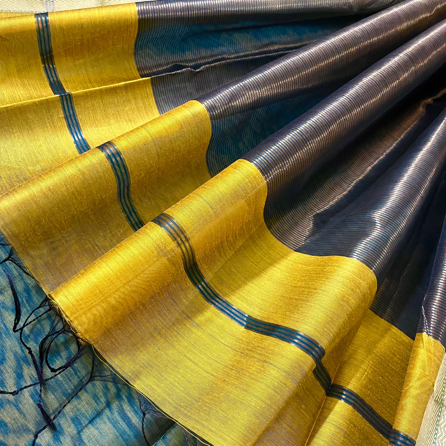 Mustard and blue maheshwari saree with flower motifs all over