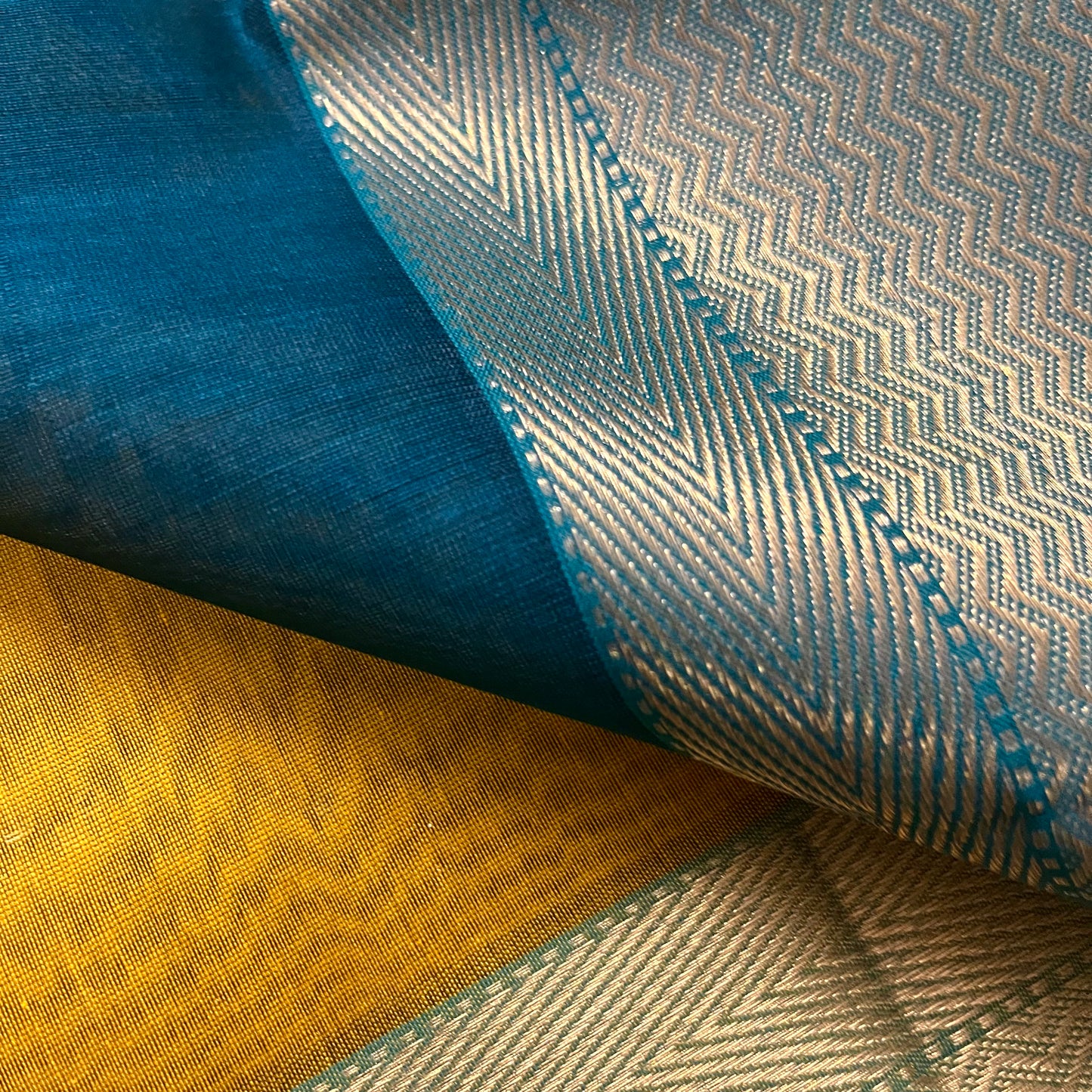 Mustard and blue maheshwari saree with flower motifs all over